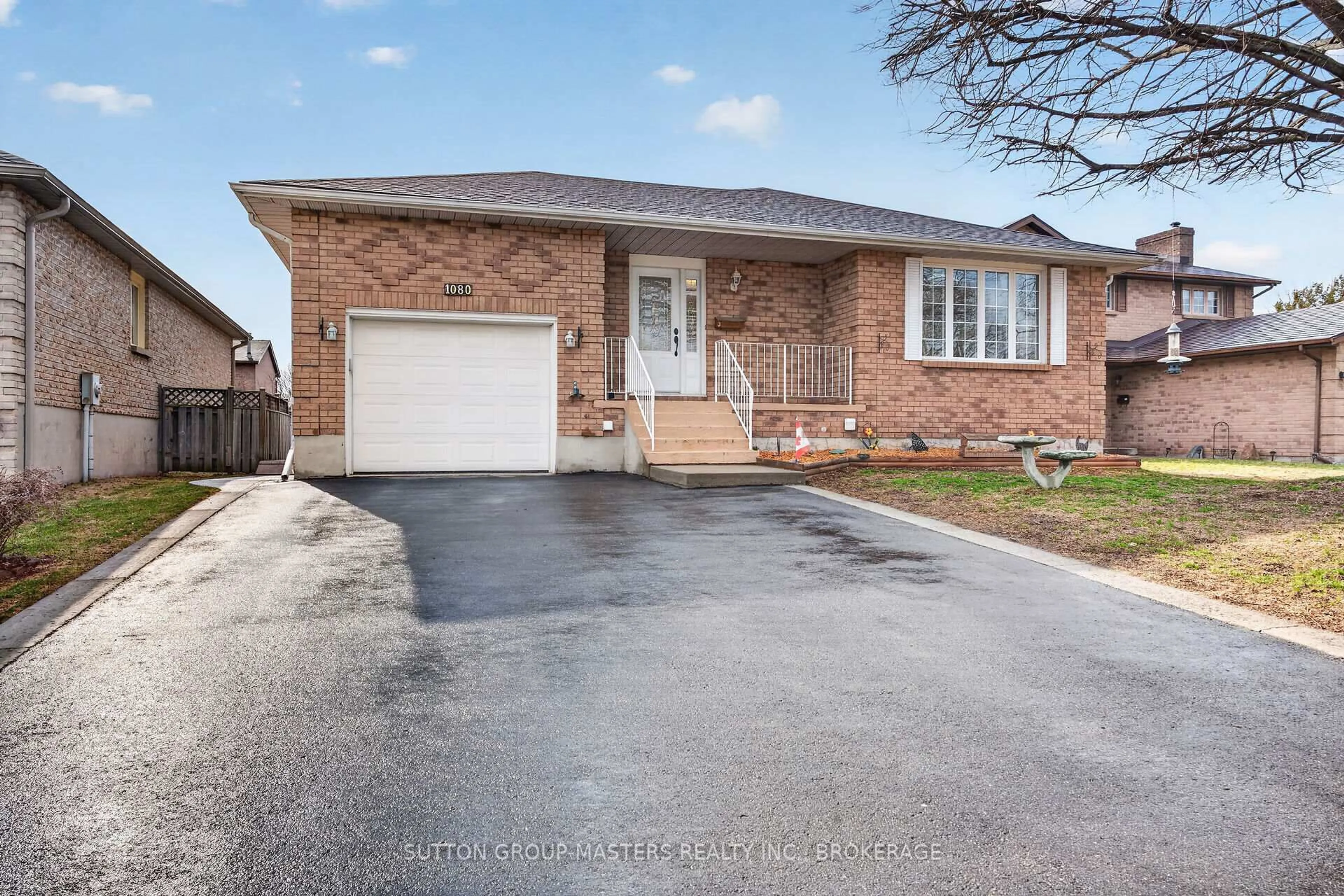 Home with brick exterior material, street for 1080 Palmerston Cres, Kingston Ontario K7P 2P5