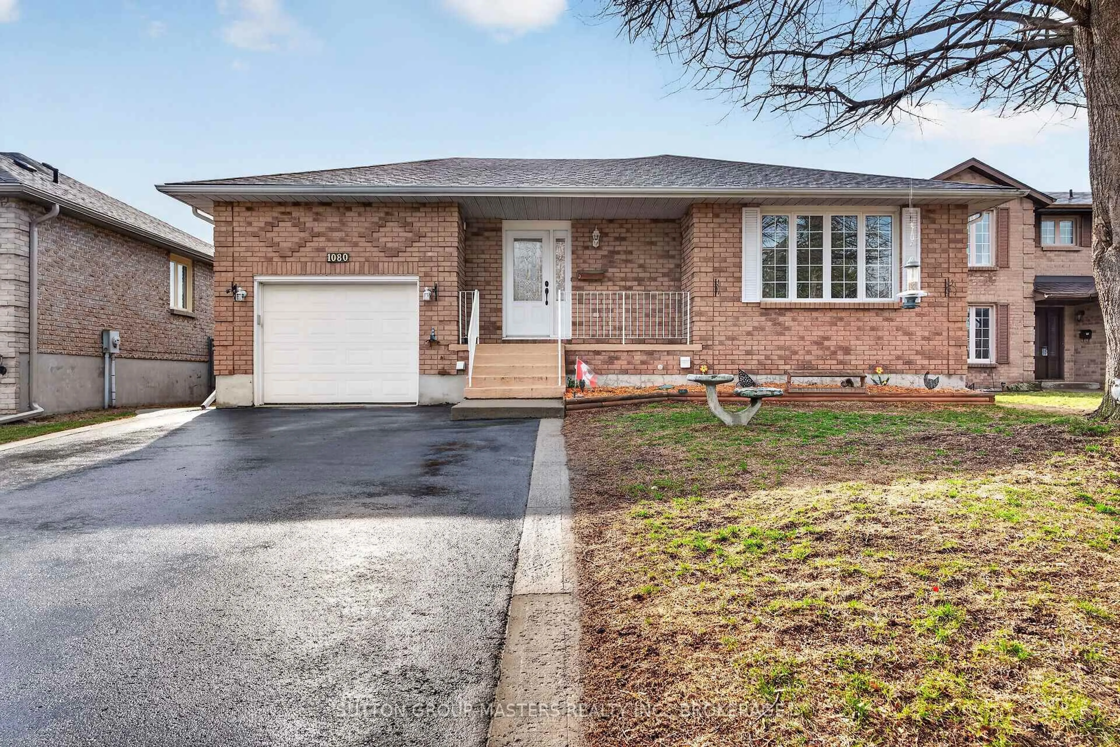 Home with brick exterior material, street for 1080 Palmerston Cres, Kingston Ontario K7P 2P5