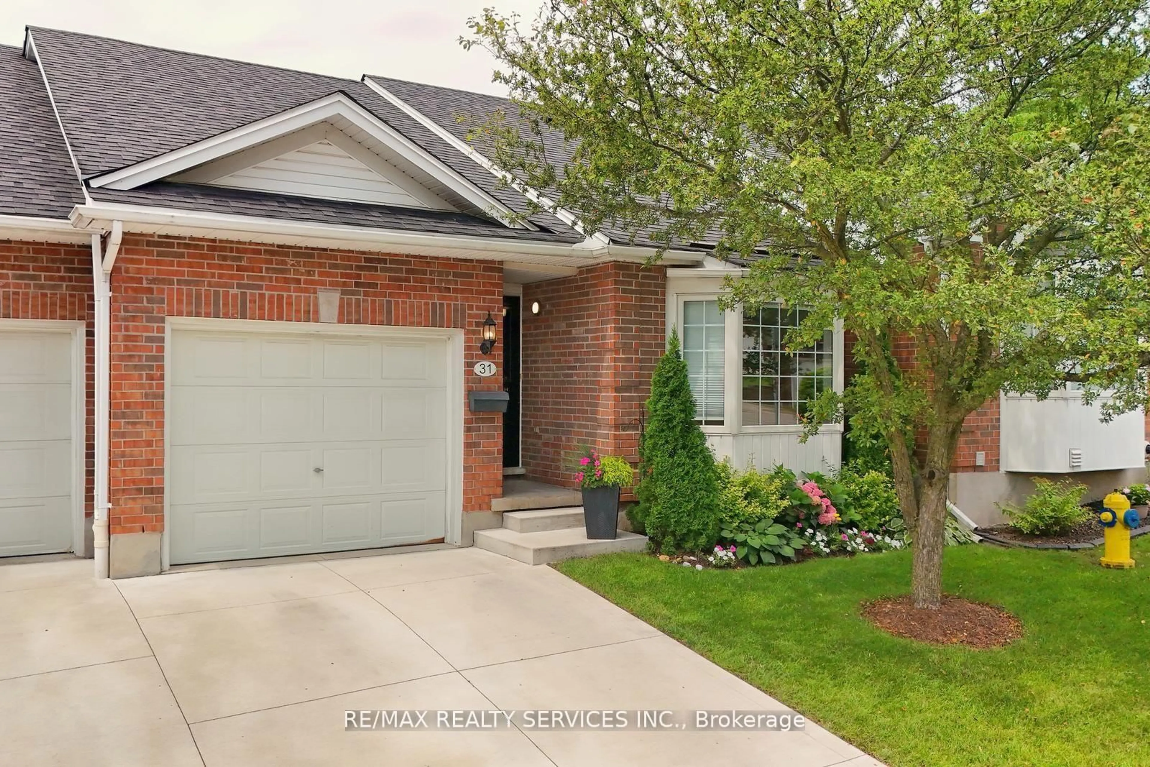 Home with brick exterior material, street for 1077 Hamilton Rd #31, London East Ontario N5W 6G3