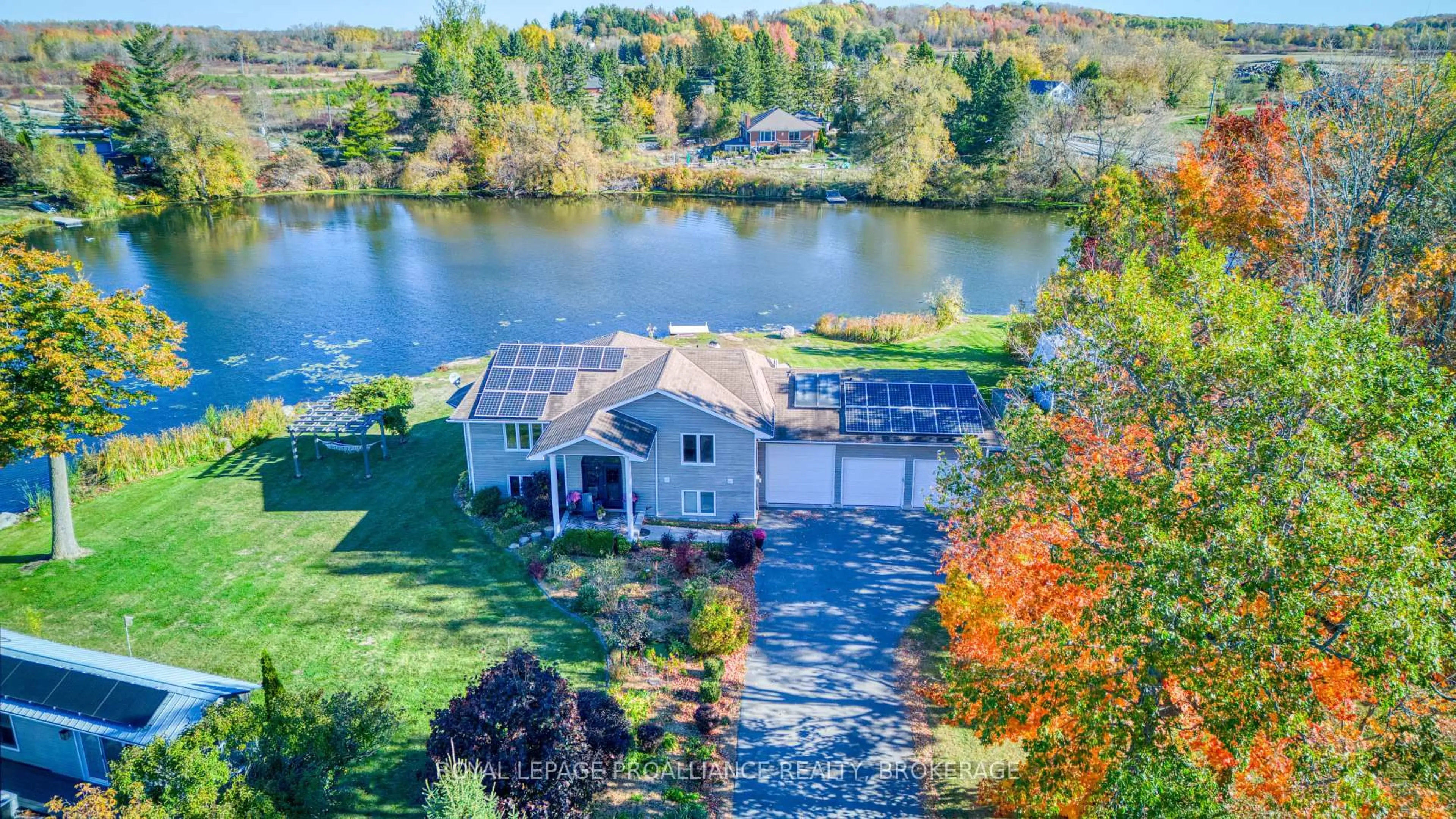 A pic from outside/outdoor area/front of a property/back of a property/a pic from drone, water/lake/river/ocean view for 2318 Highway 15, Kingston Ontario K7L 4V3
