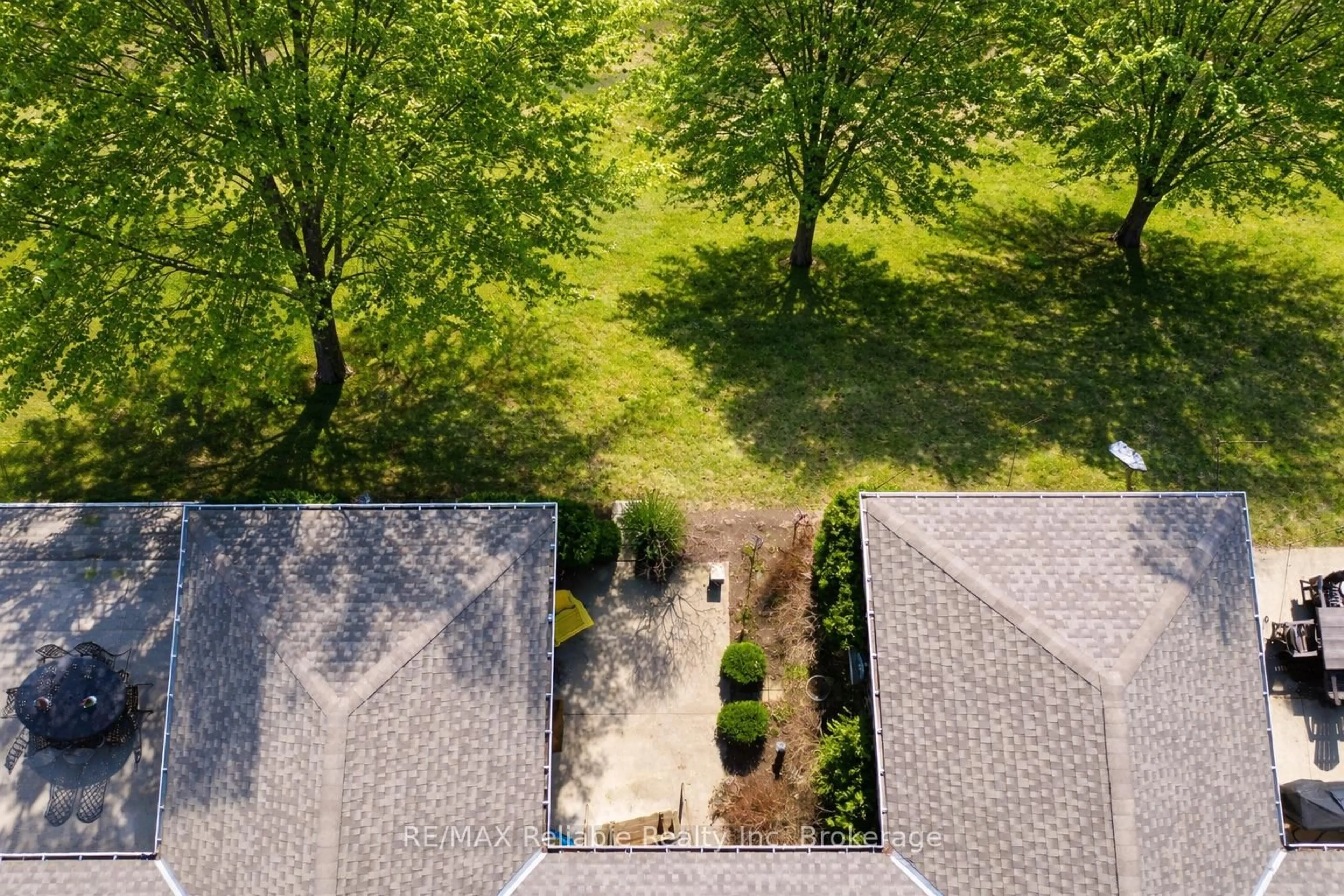 A pic from outside/outdoor area/front of a property/back of a property/a pic from drone, forest/trees view for 24 BAYFIELD MEWS Lane, Bluewater Ontario N0M 1G0