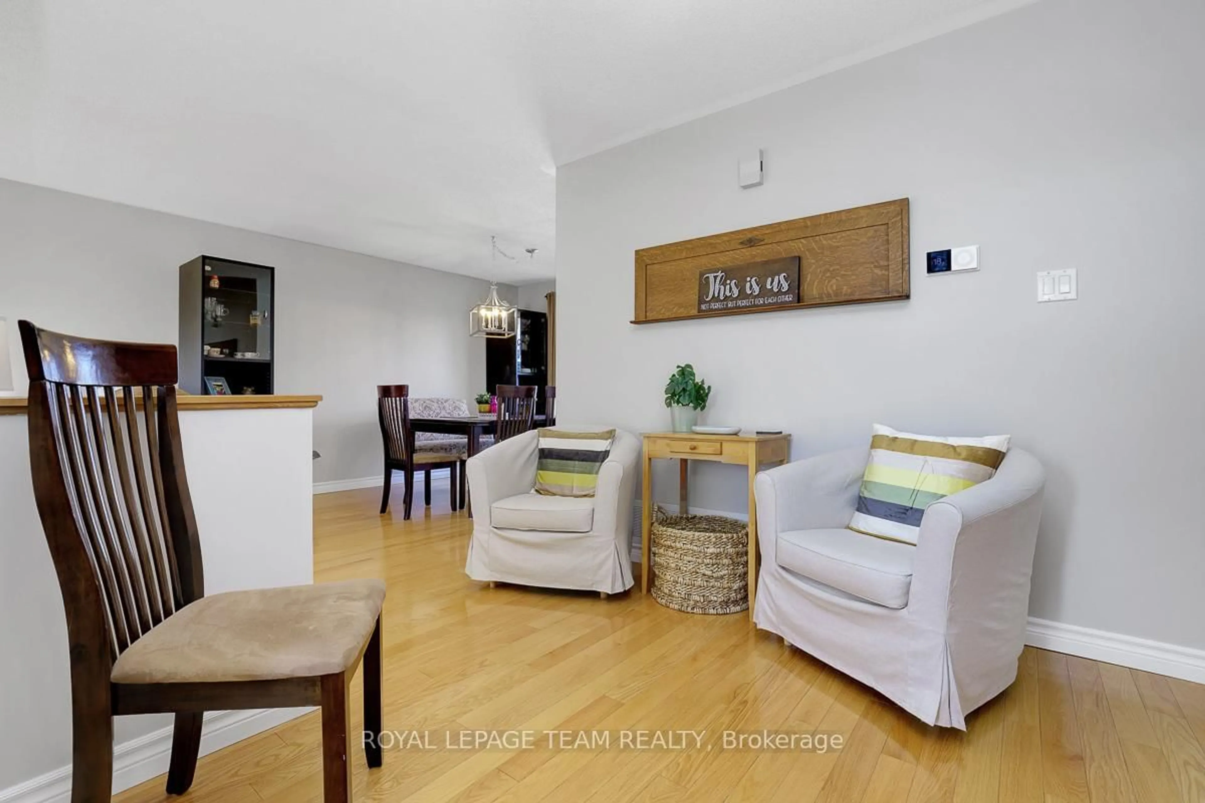 Living room with furniture, wood/laminate floor for 704 Maley St, North Grenville Ontario K0G 1J0