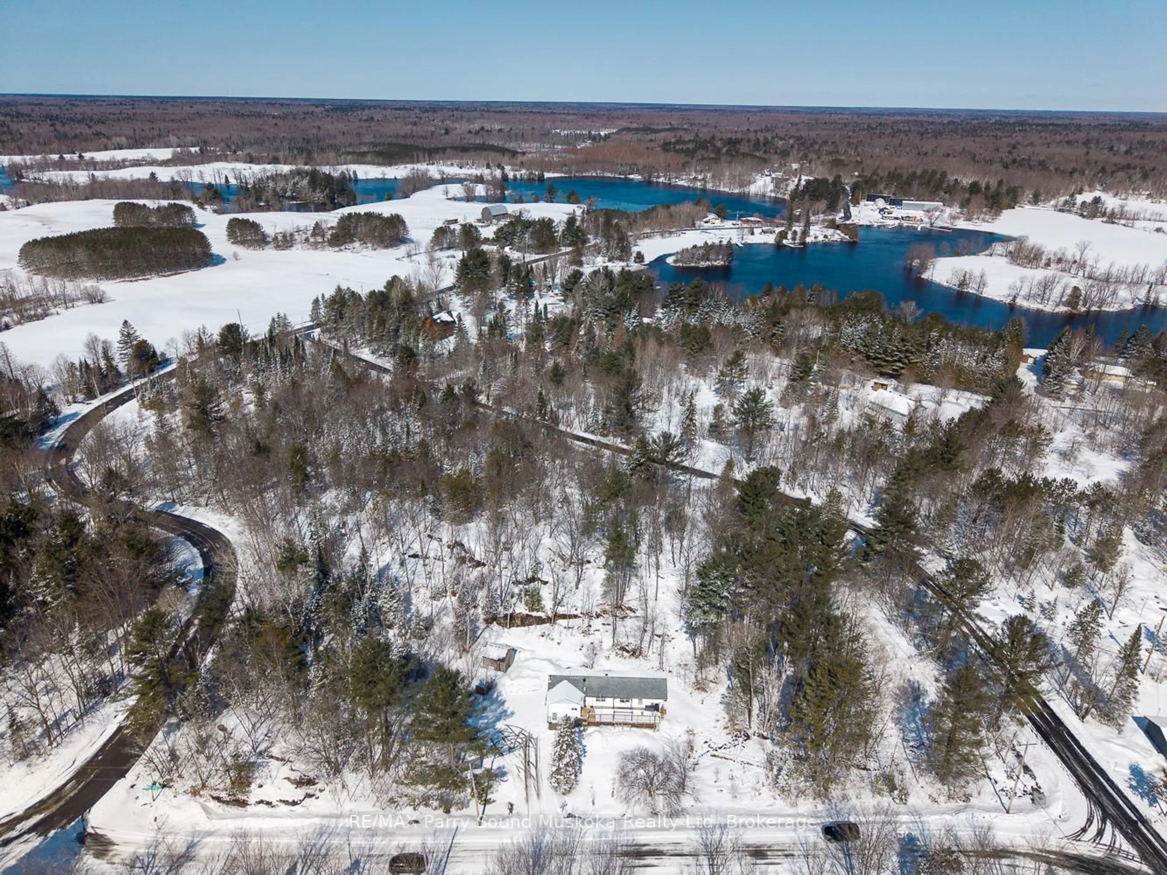A pic from outside/outdoor area/front of a property/back of a property/a pic from drone, water/lake/river/ocean view for 1 Ted Donnelly Rd, McKellar Ontario P2A 0B5