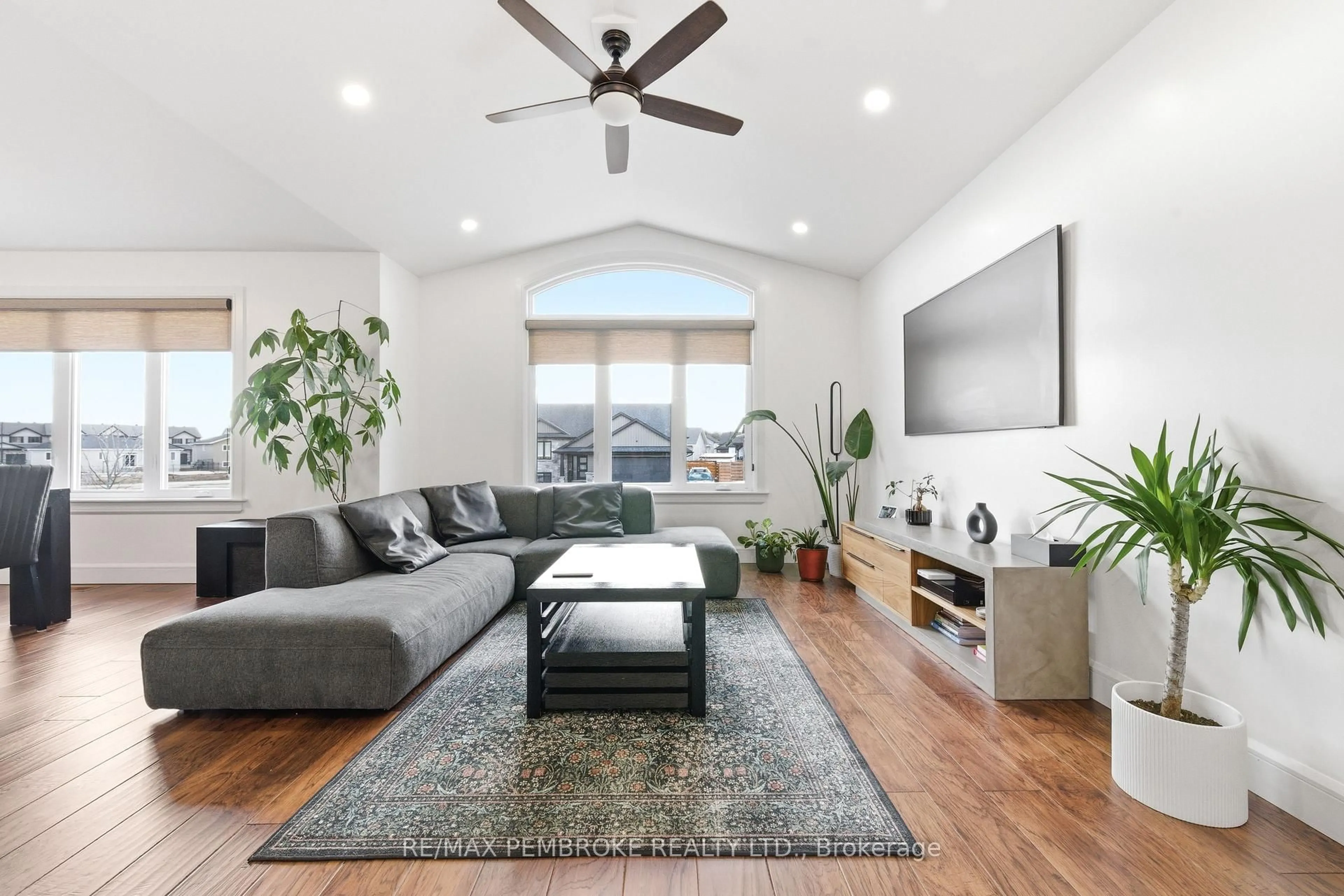 Living room with furniture, wood/laminate floor for 20 Liam St, Petawawa Ontario K8H 0C2