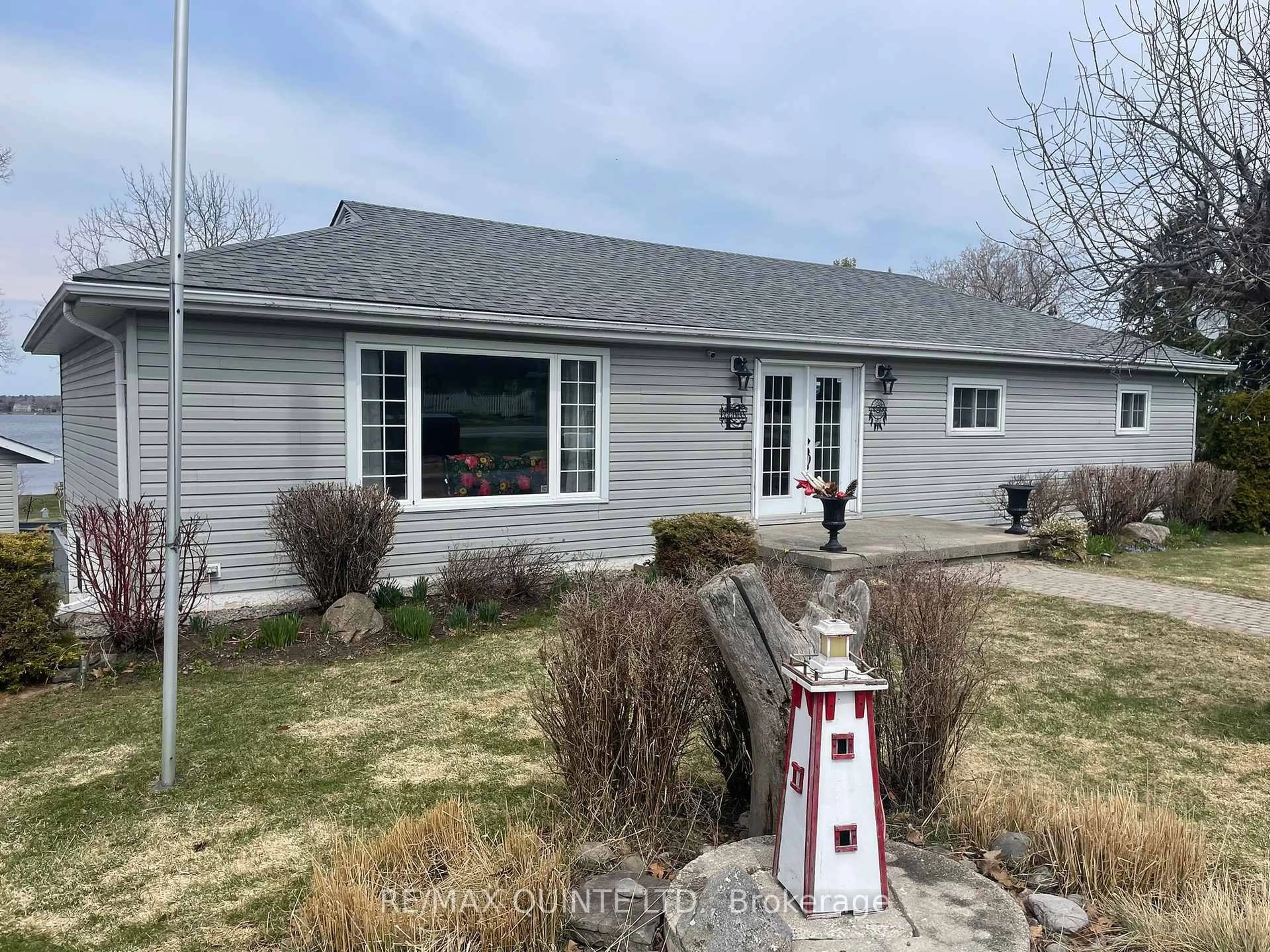 Home with vinyl exterior material, street for 1752 County Road 3, Prince Edward County Ontario K0K 1A0