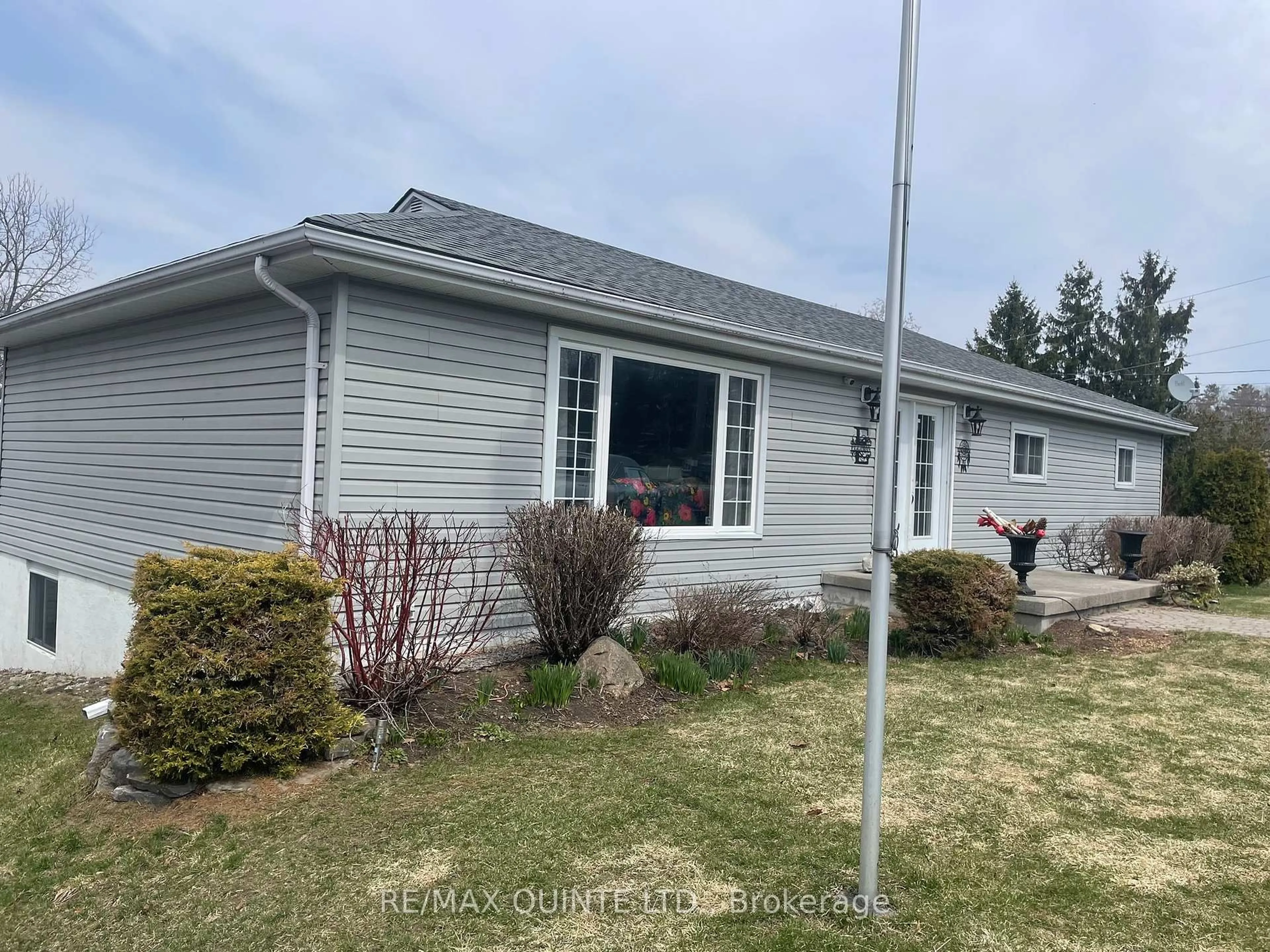 Home with vinyl exterior material, street for 1752 County Road 3, Prince Edward County Ontario K0K 1A0