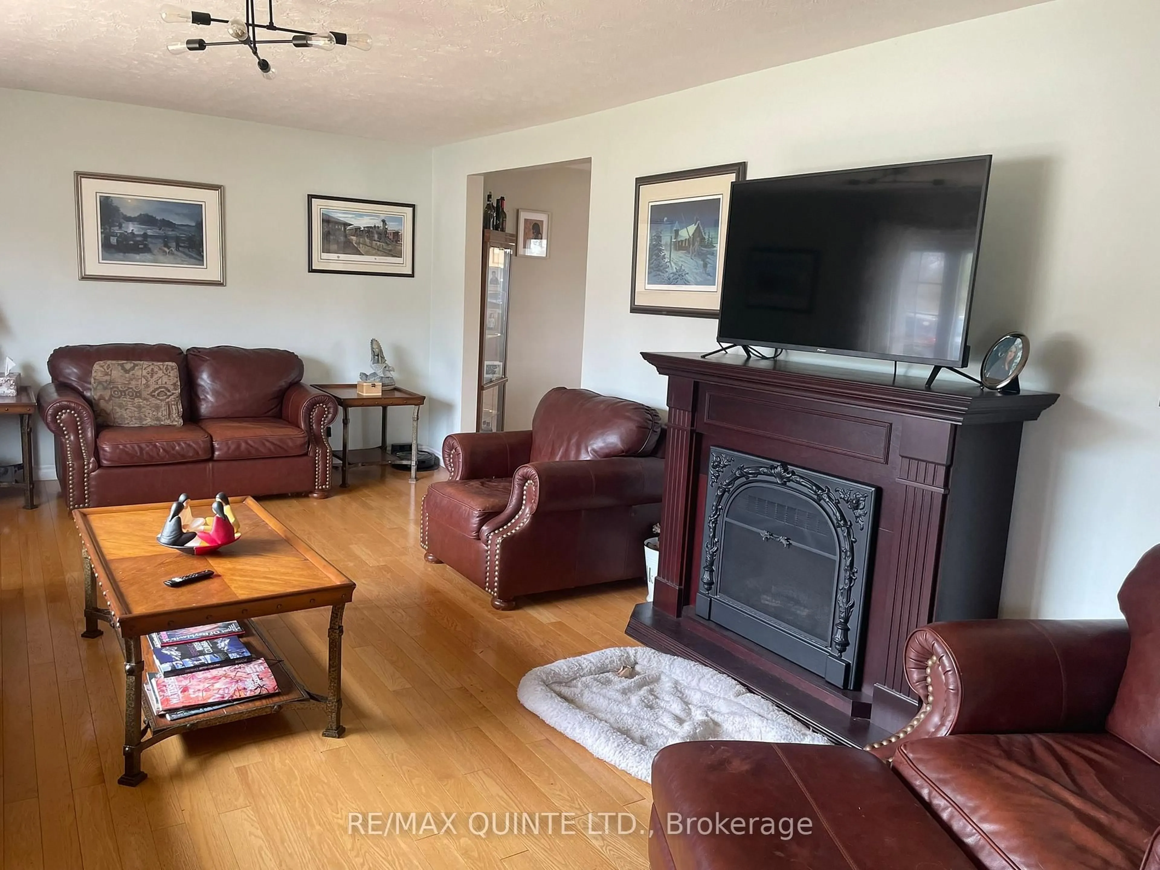 Living room with furniture, wood/laminate floor for 1752 County Road 3, Prince Edward County Ontario K0K 1A0