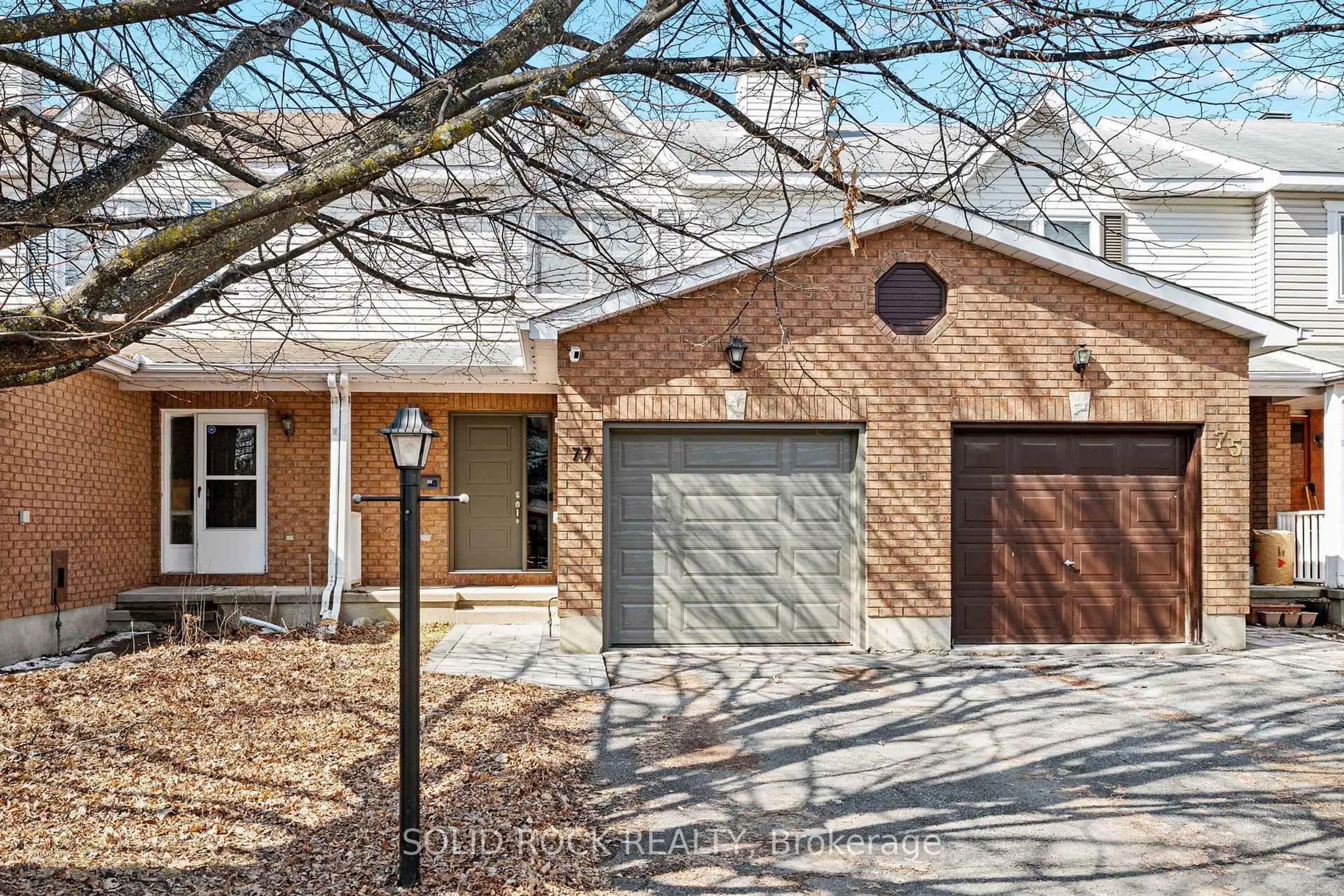 Home with brick exterior material, street for 77 Markland Cres, Ottawa Ontario K2G 5Z6