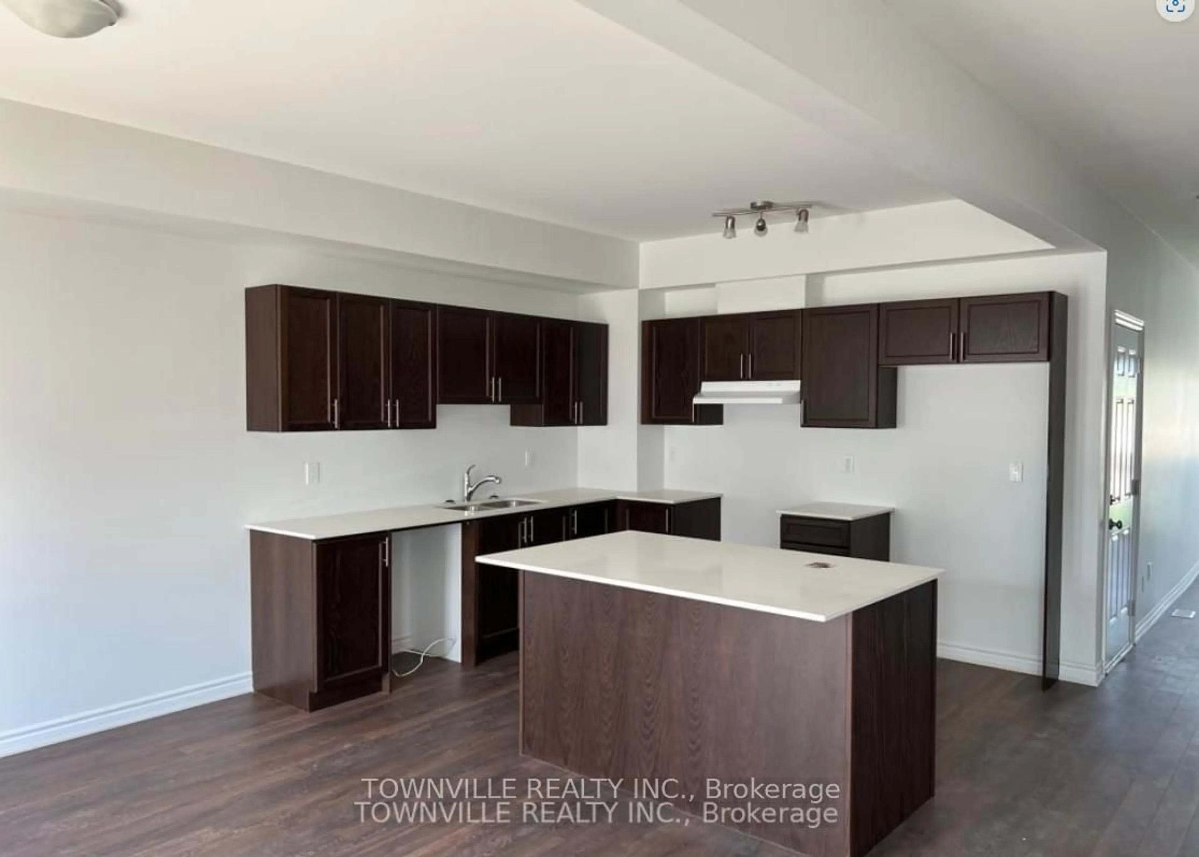 Open concept kitchen, wood/laminate floor for 18 Lincoln Dr, Belleville Ontario K8N 0T8