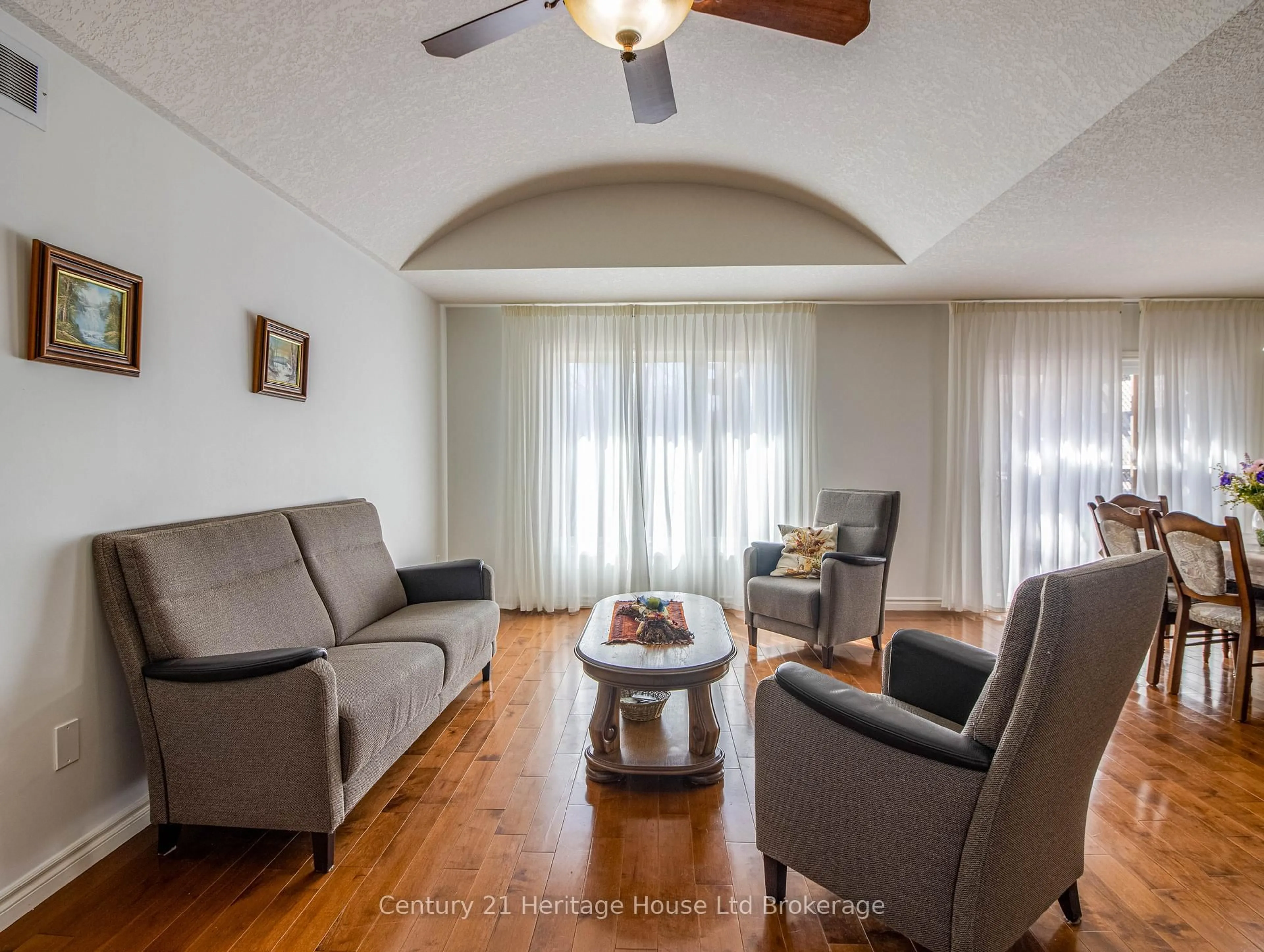 Living room with furniture, wood/laminate floor for 169 First St, Woolwich Ontario N3B 1H1