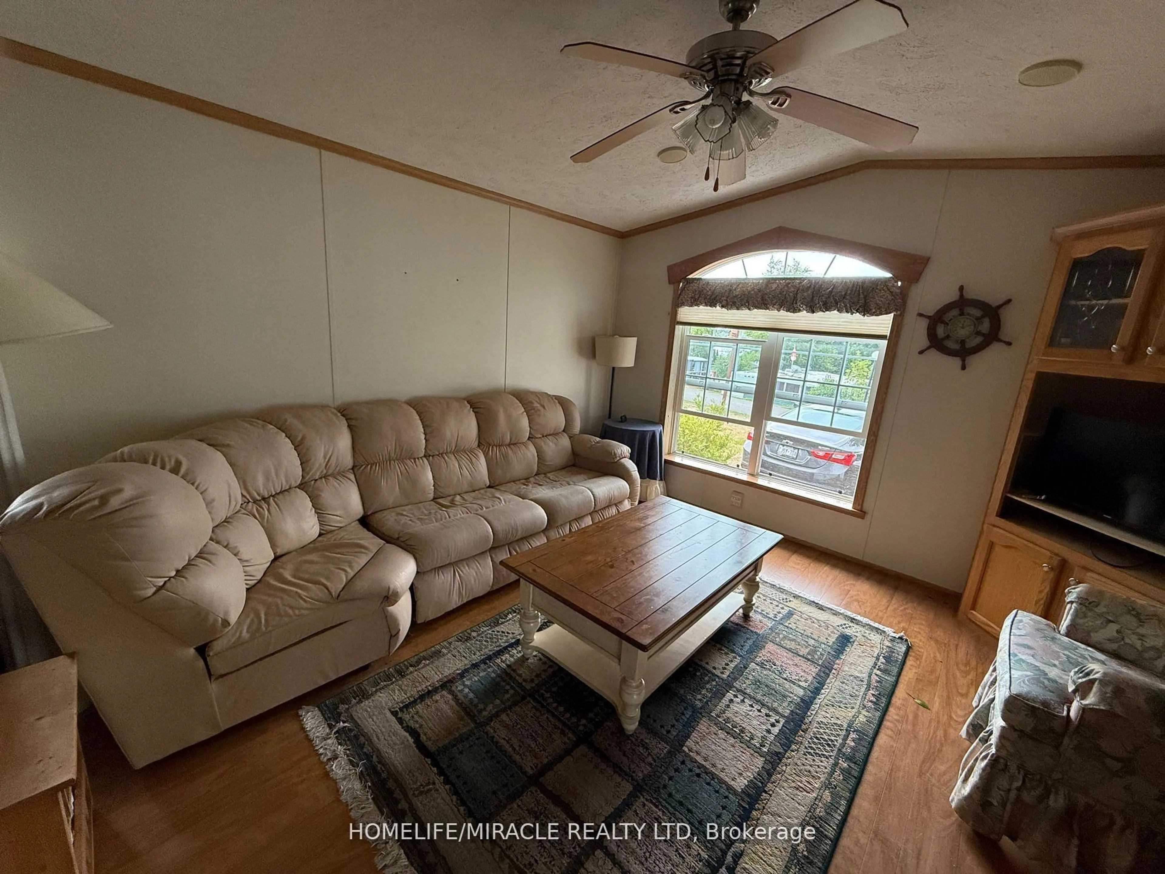 Living room with furniture, wood/laminate floor for 11 Grandview Dr, Peterborough Ontario K0L 2G0