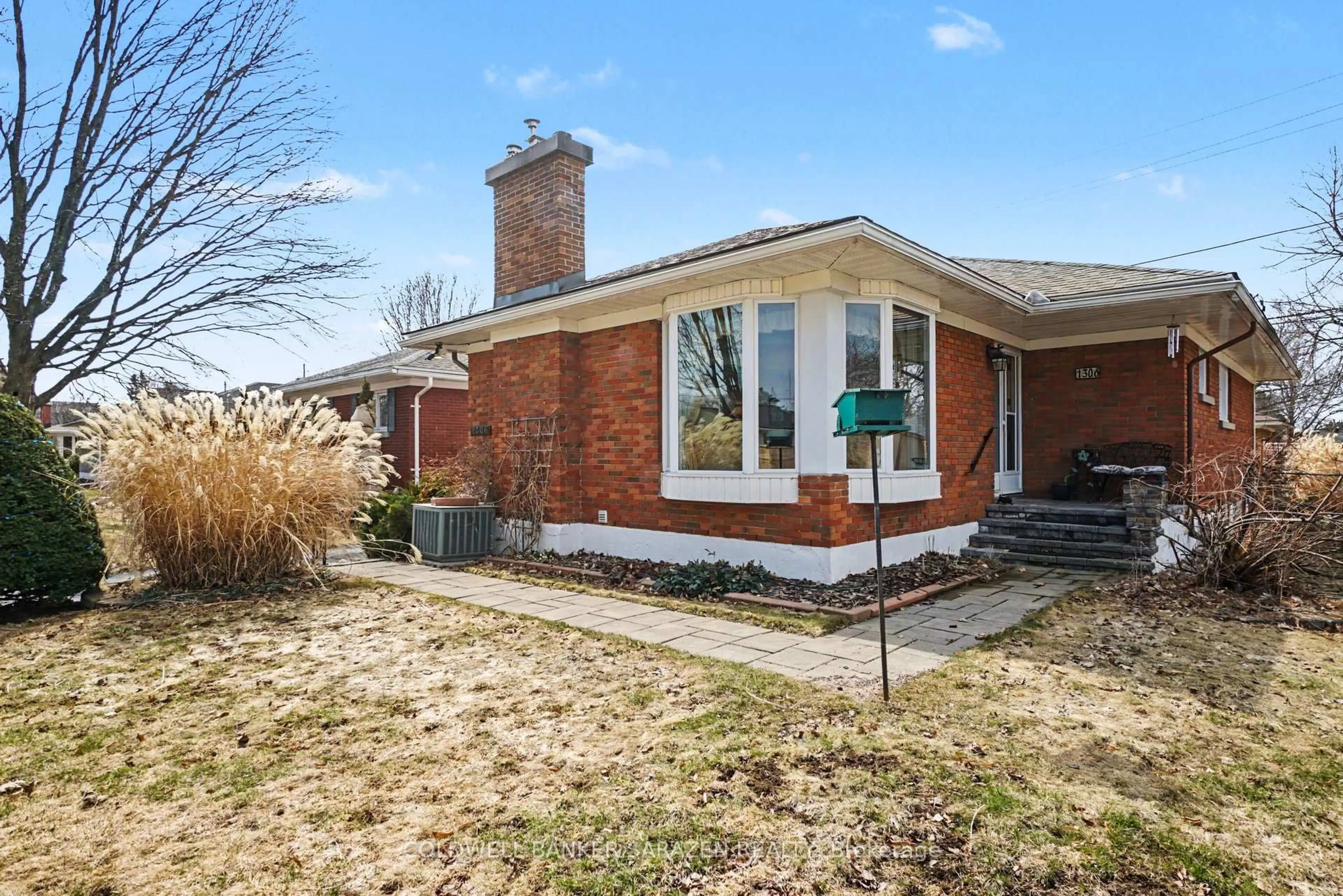 Home with brick exterior material, street for 1306 Hanbury St, Ottawa Ontario K2C 2M2