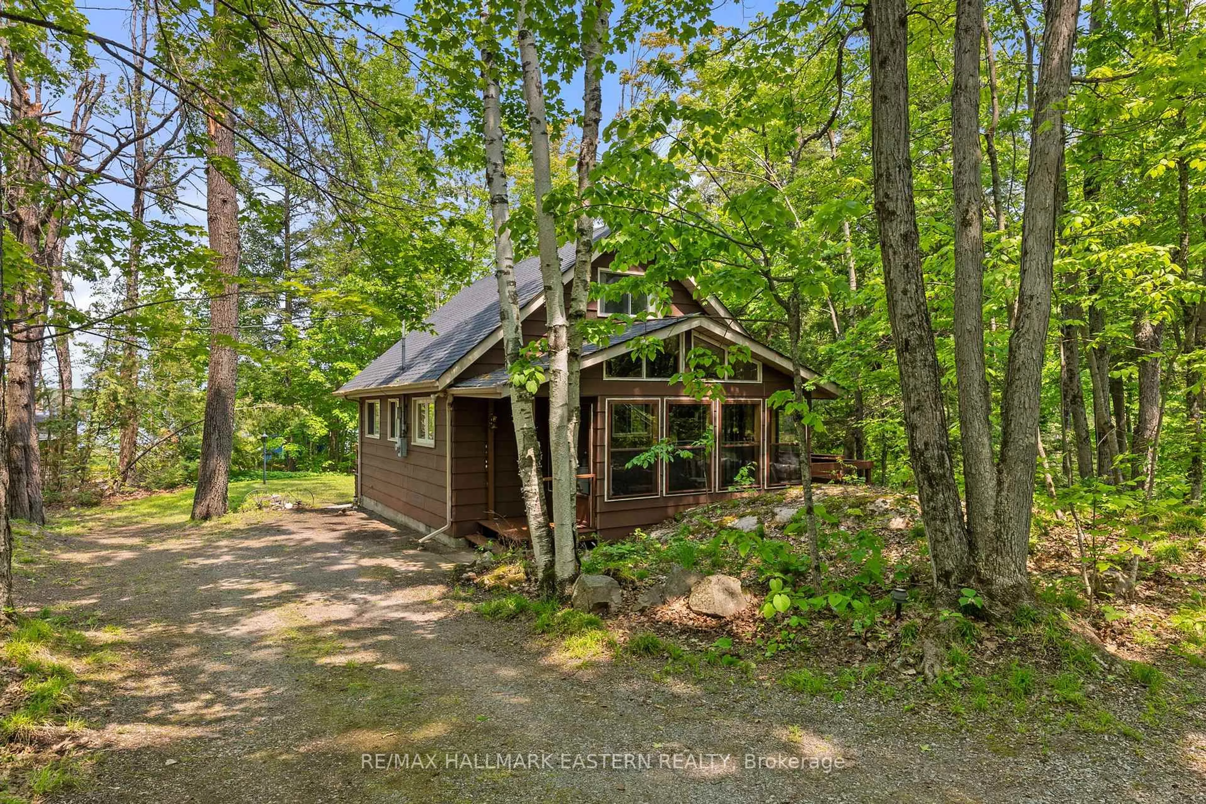 A pic from outside/outdoor area/front of a property/back of a property/a pic from drone, forest/trees view for 68 Irwin Dr, Trent Lakes Ontario K0L 1J0