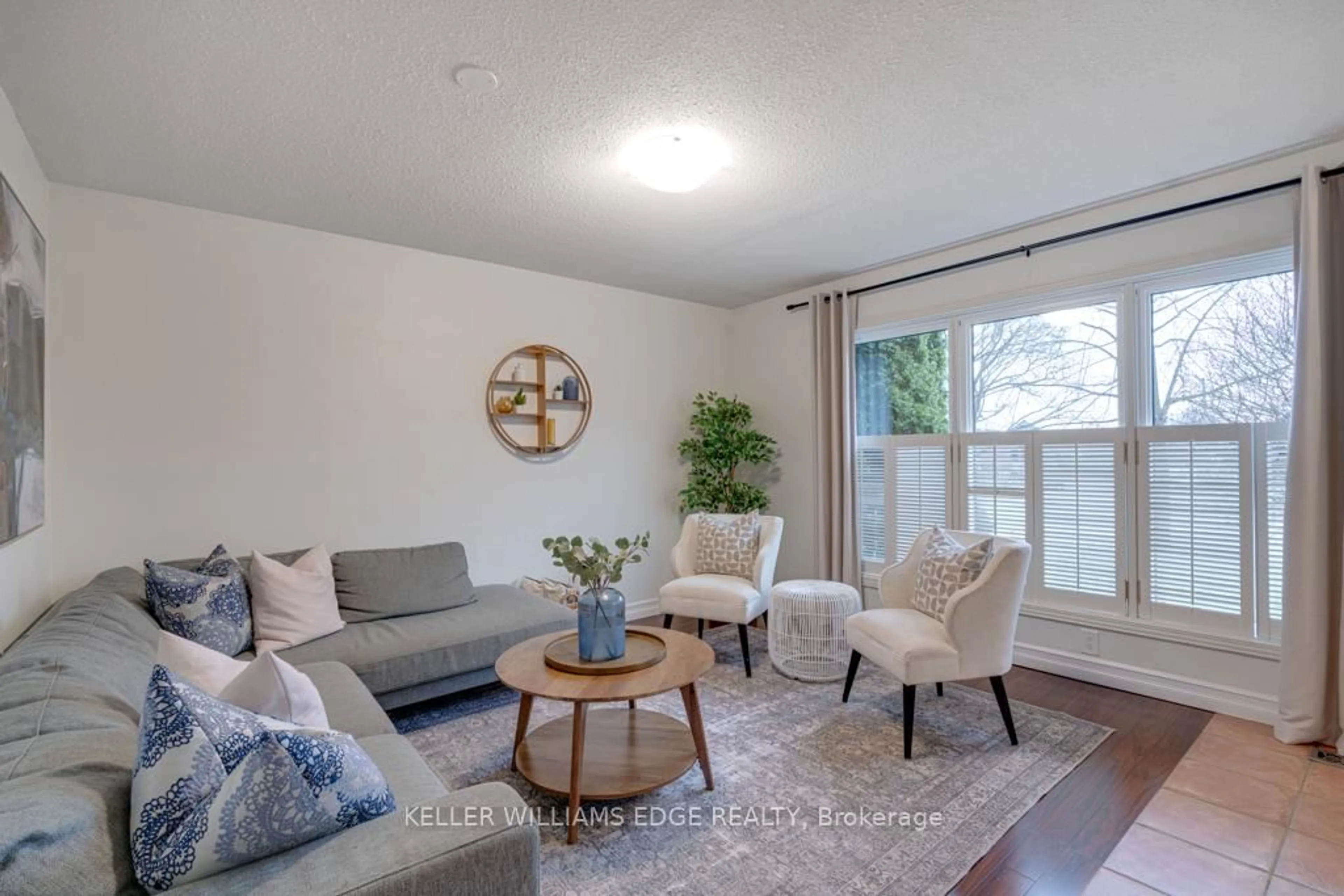 Living room with furniture, wood/laminate floor for 24 Bentley Pl, Hamilton Ontario L9C 2R4