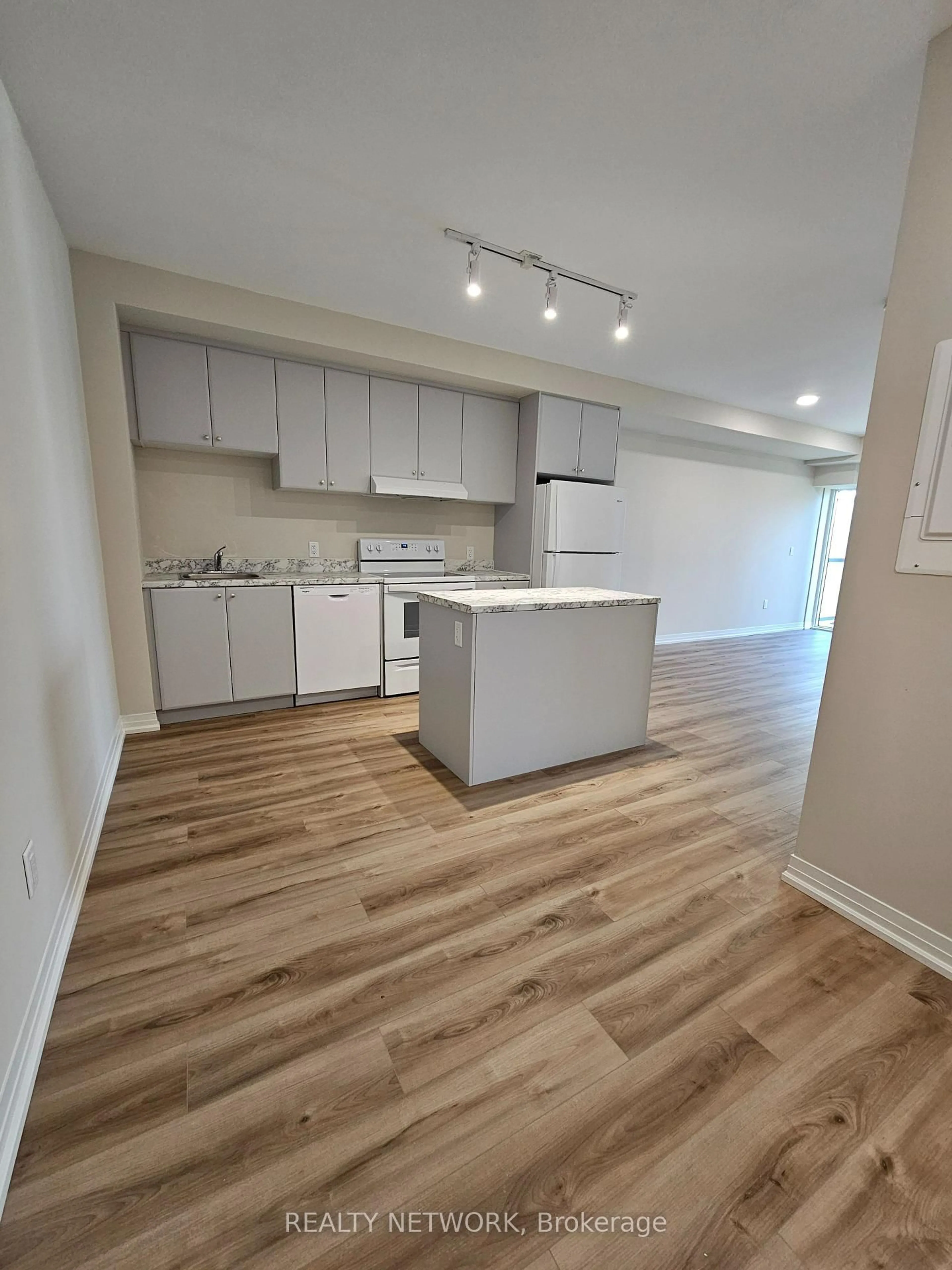 Open concept kitchen, wood/laminate floor for 50 Herrick Ave #339, St. Catharines Ontario L2P 0G3