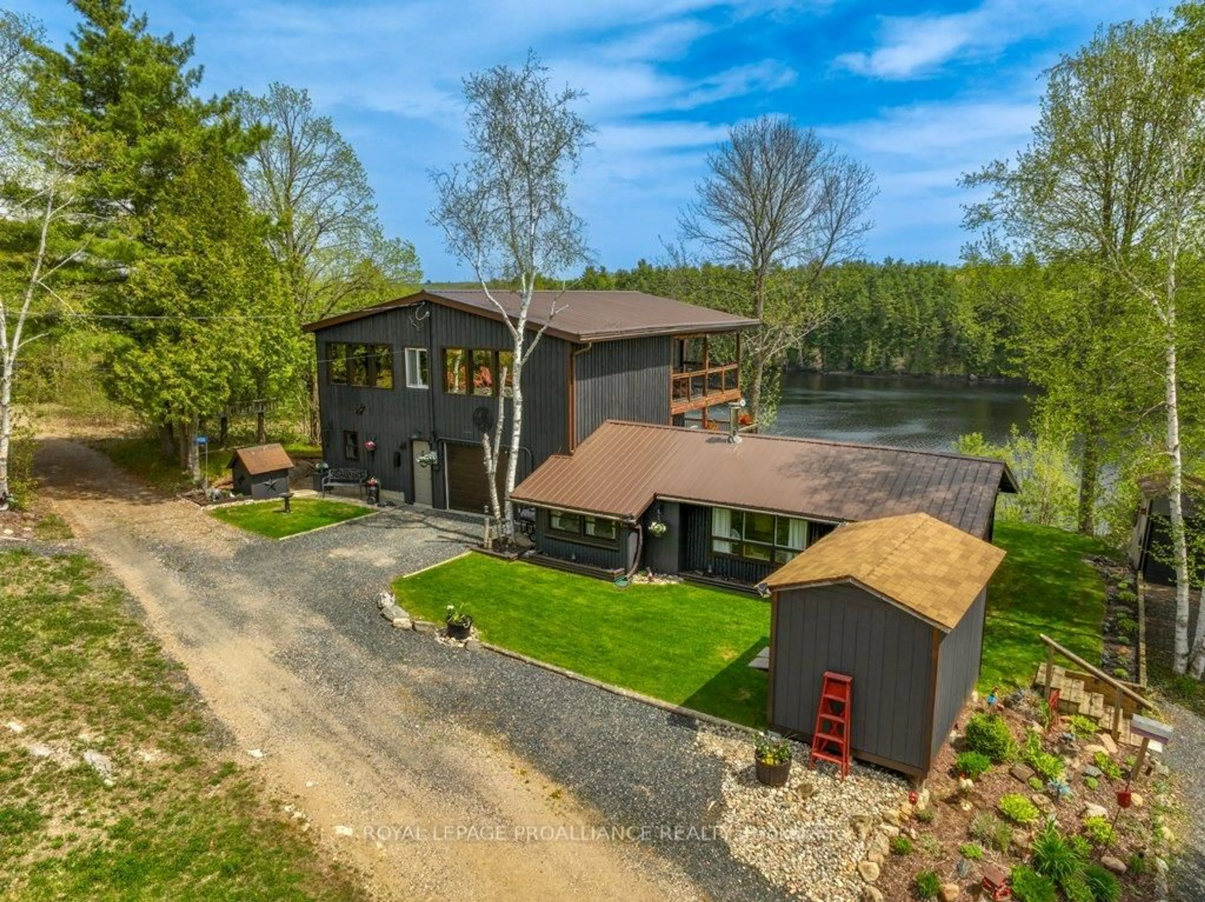 A pic from outside/outdoor area/front of a property/back of a property/a pic from drone, water/lake/river/ocean view for 1130 Hummingbird Lane, Central Frontenac Ontario K0H 0B6