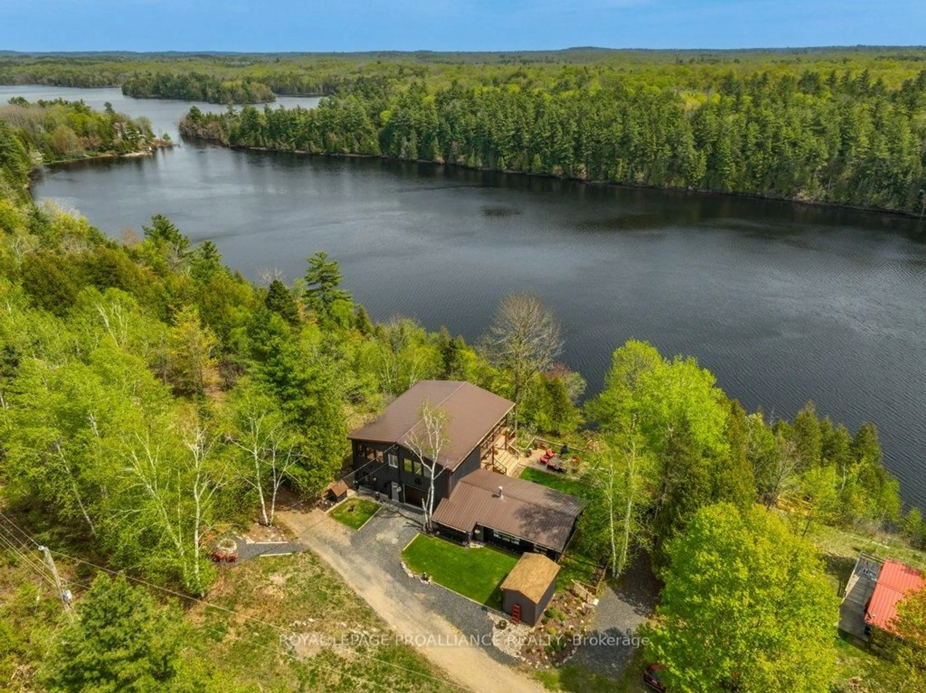 A pic from outside/outdoor area/front of a property/back of a property/a pic from drone, water/lake/river/ocean view for 1130 Hummingbird Lane, Central Frontenac Ontario K0H 0B6