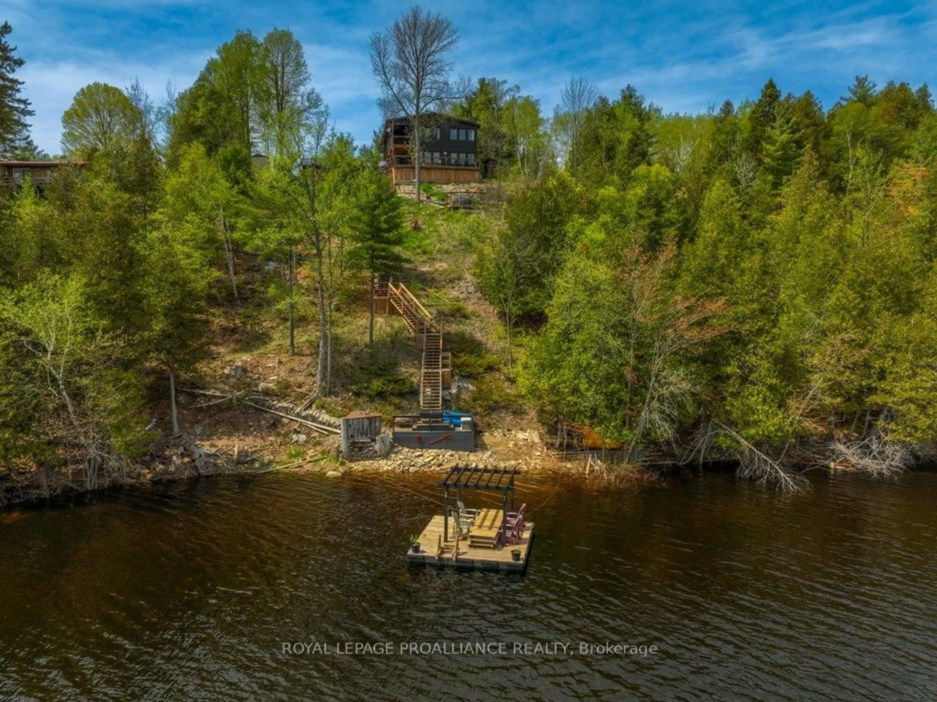A pic from outside/outdoor area/front of a property/back of a property/a pic from drone, water/lake/river/ocean view for 1130 Hummingbird Lane, Central Frontenac Ontario K0H 0B6