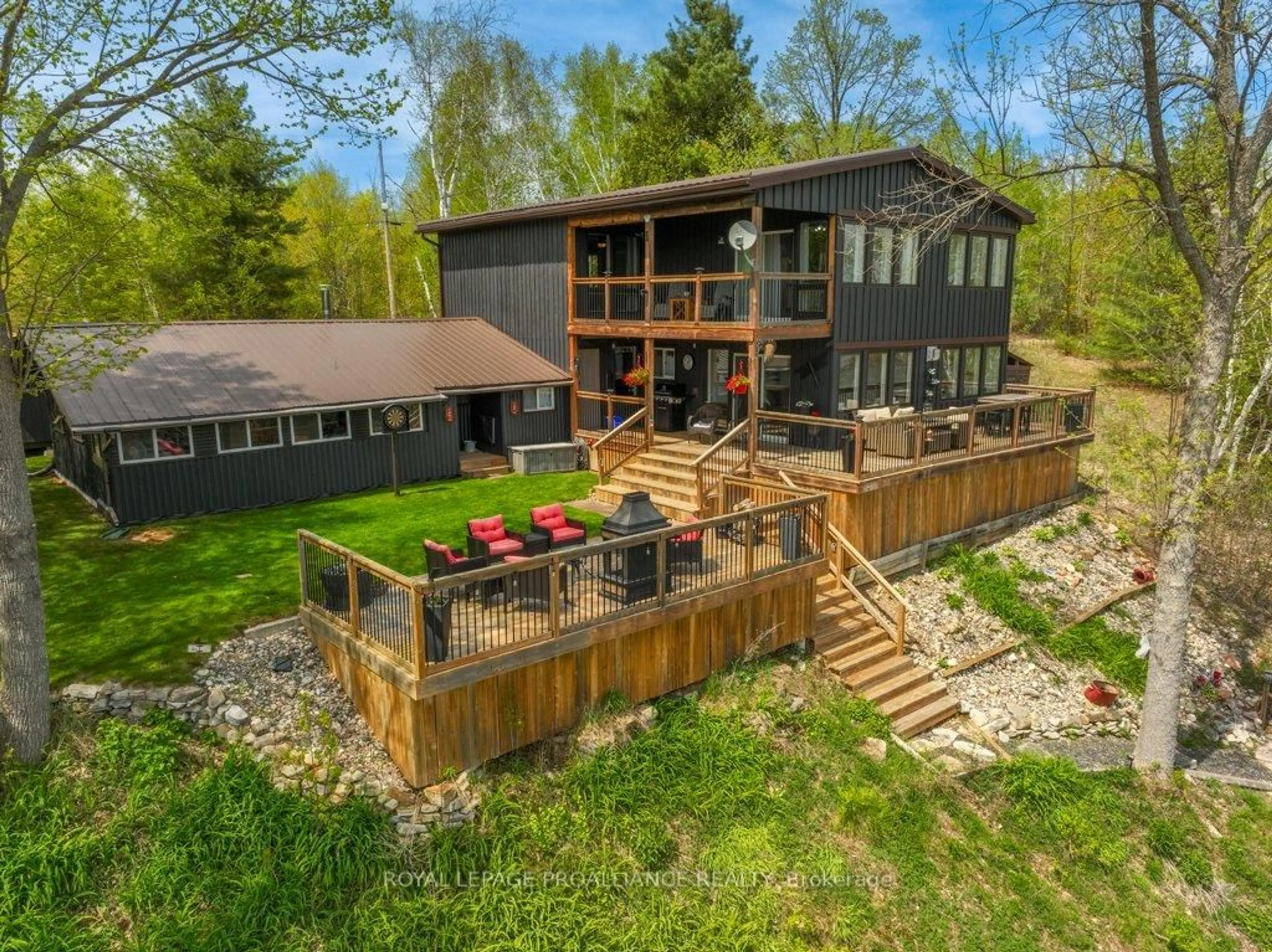 A pic from outside/outdoor area/front of a property/back of a property/a pic from drone, water/lake/river/ocean view for 1130 Hummingbird Lane, Central Frontenac Ontario K0H 0B6