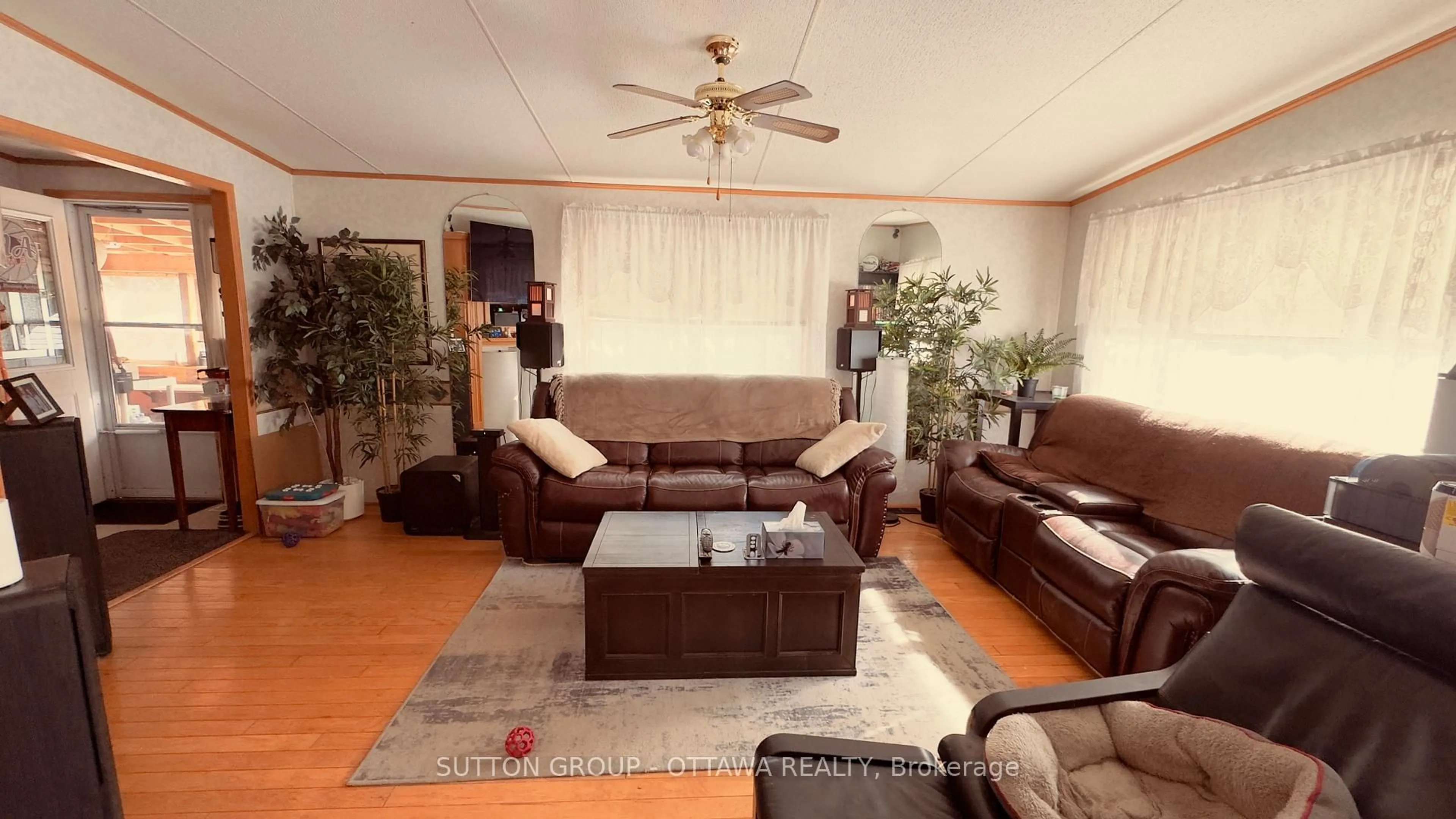 Living room with furniture, wood/laminate floor for 8 Yvette Private, Ashton Ontario K0A 1B0