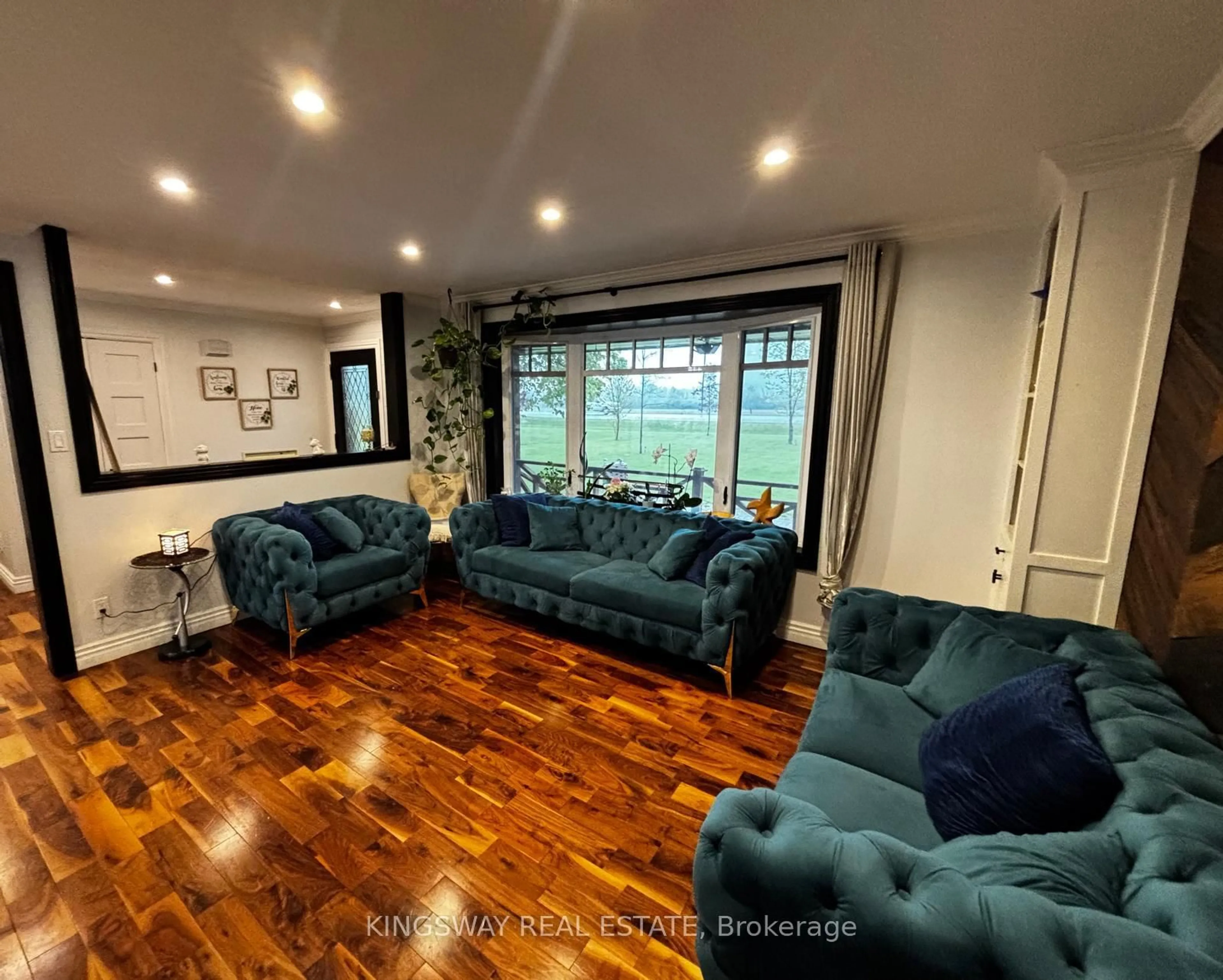 Living room with furniture, wood/laminate floor for 9364 Wellington Rd #124, Erin Ontario N0B 1T0