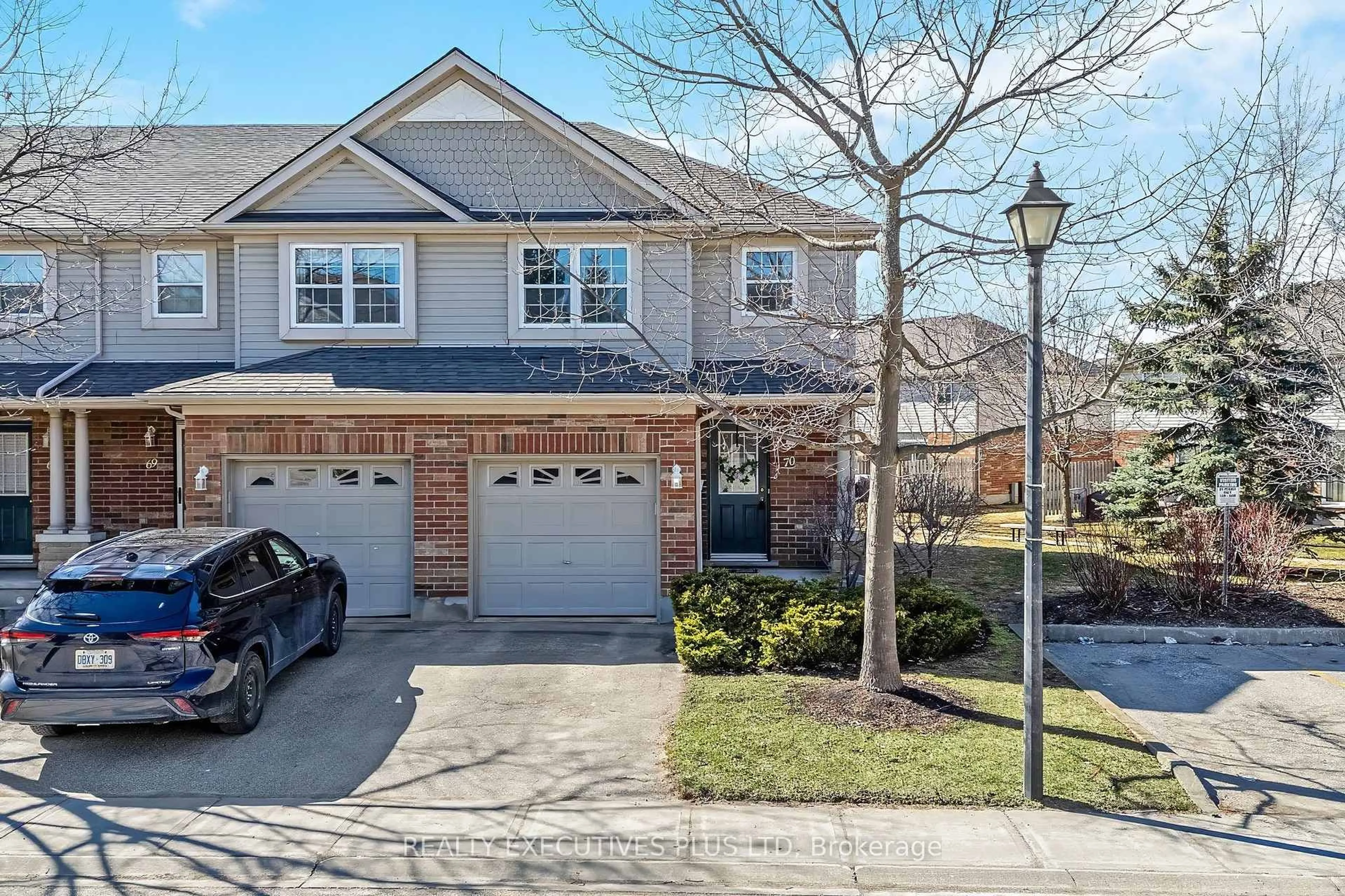 Home with brick exterior material, street for 30 Imperial Rd #70, Guelph Ontario N1K 1Y2