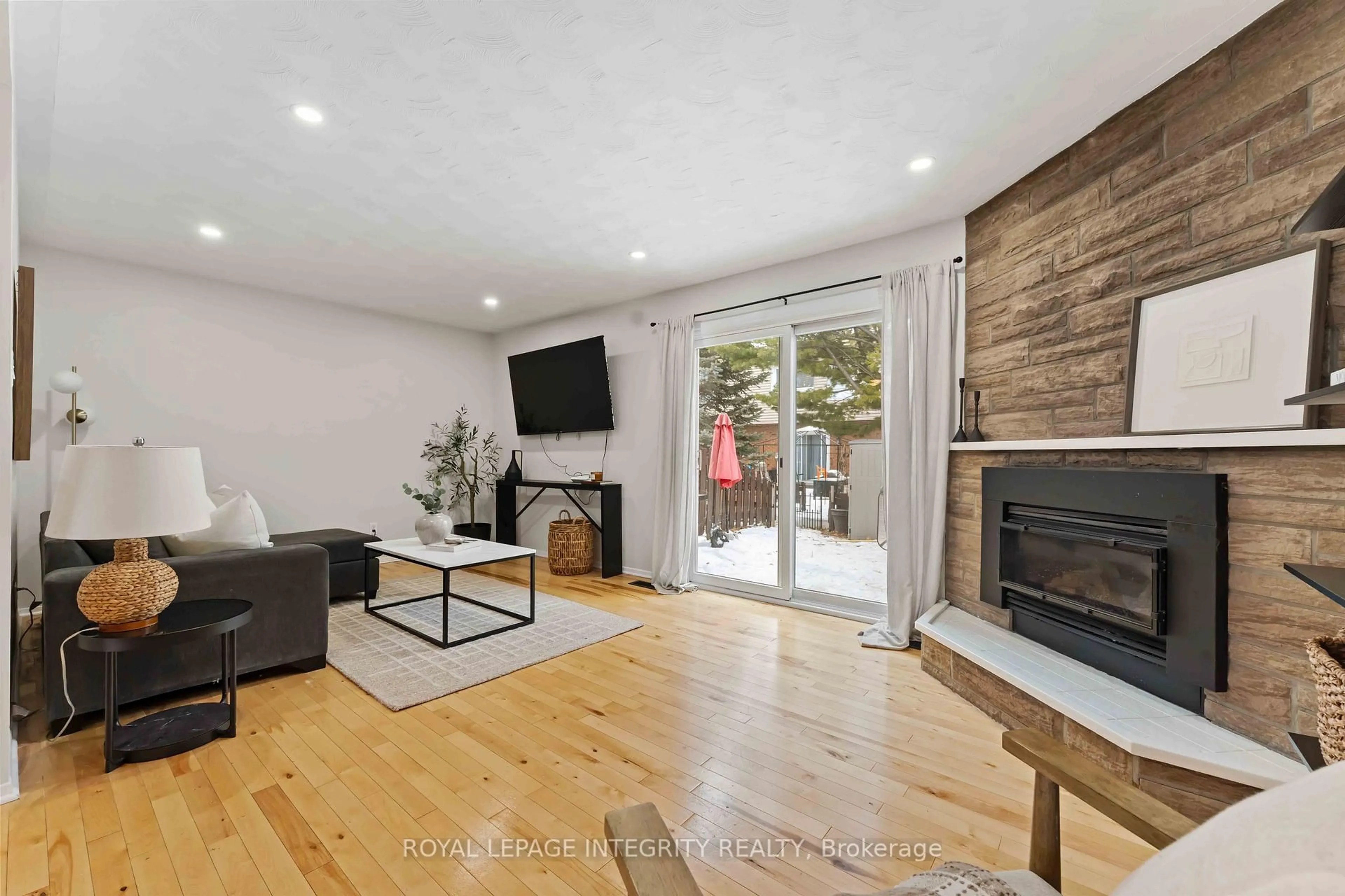 Living room with furniture, wood/laminate floor for 1585 Heron Rd #19, Ottawa Ontario K1V 9V1