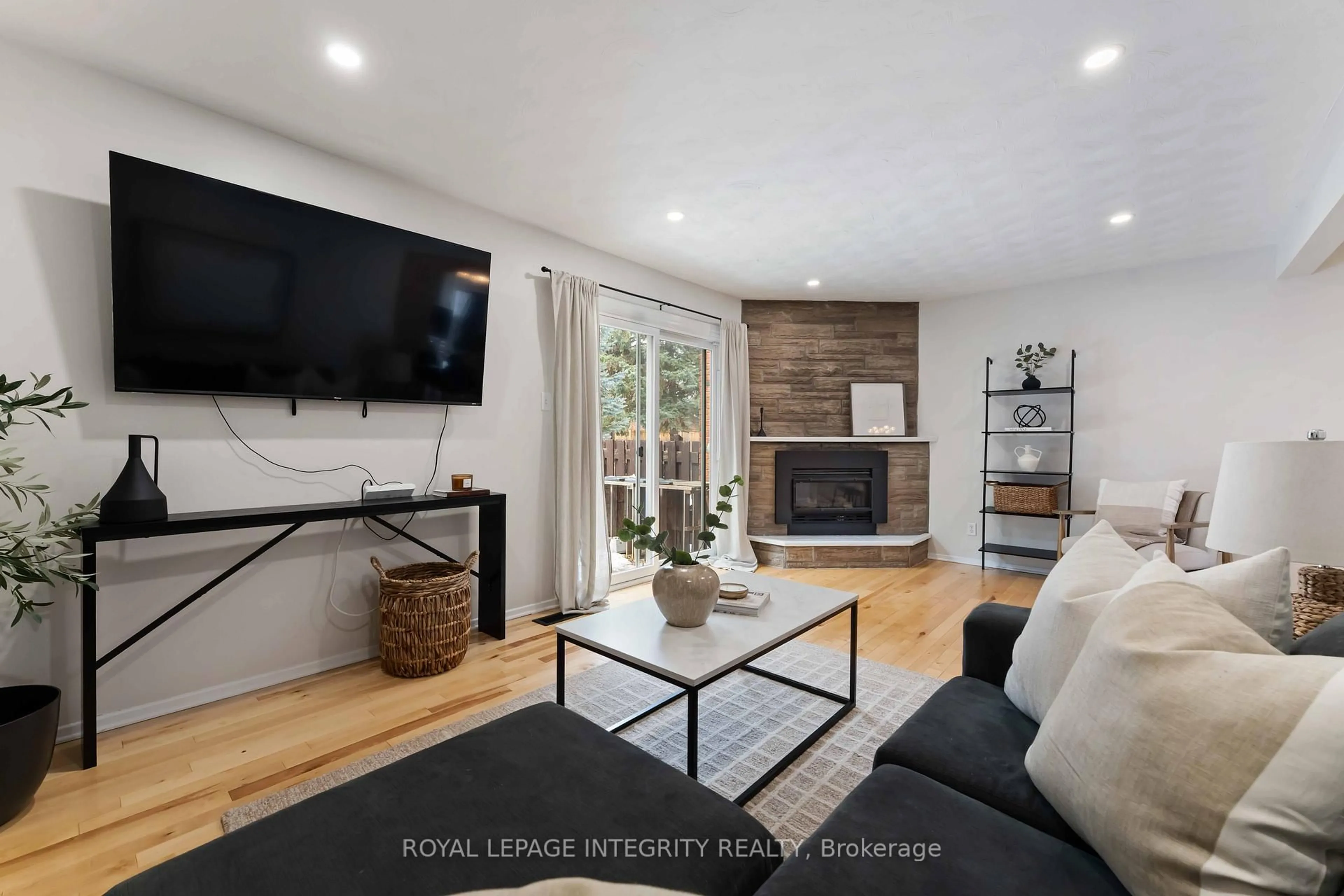 Living room with furniture, wood/laminate floor for 1585 Heron Rd #19, Ottawa Ontario K1V 9V1