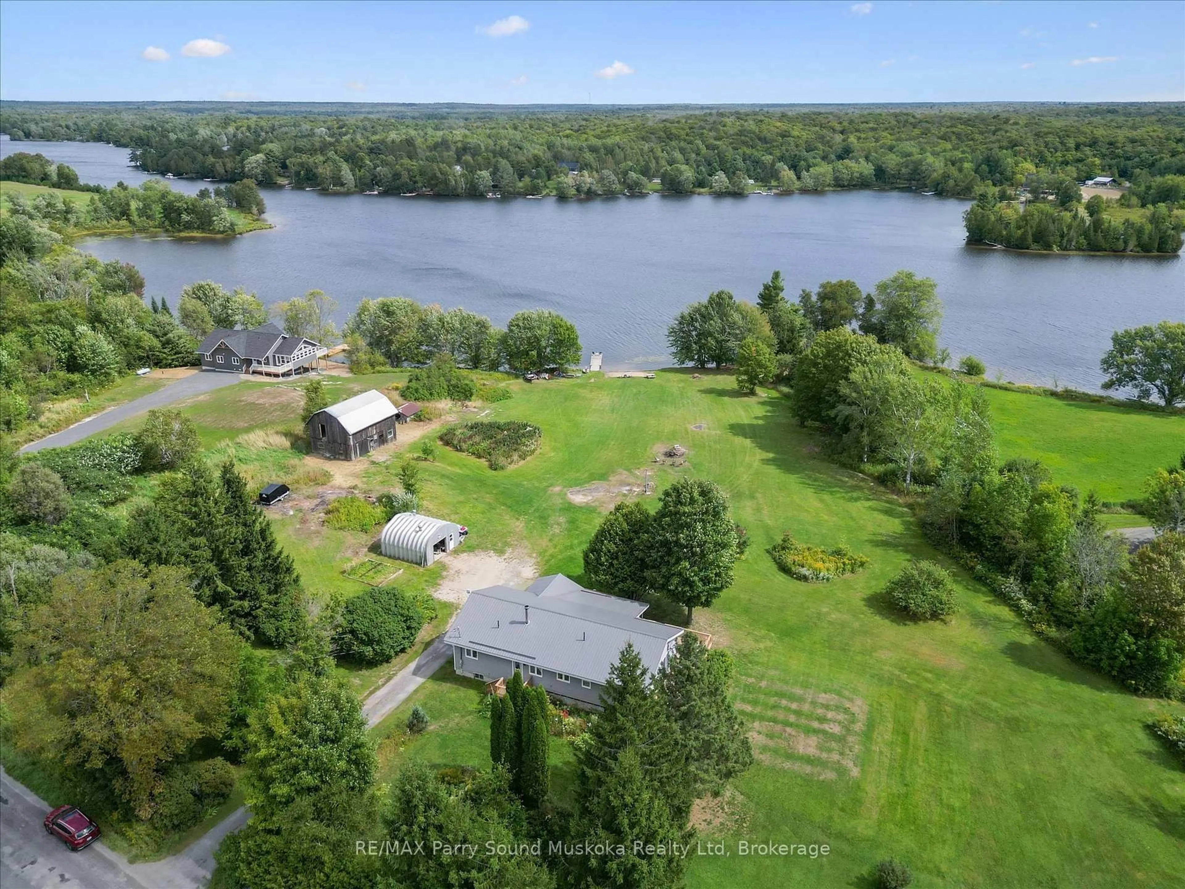 A pic from outside/outdoor area/front of a property/back of a property/a pic from drone, water/lake/river/ocean view for 39 Hardies Rd, McKellar Ontario P2A 0B5