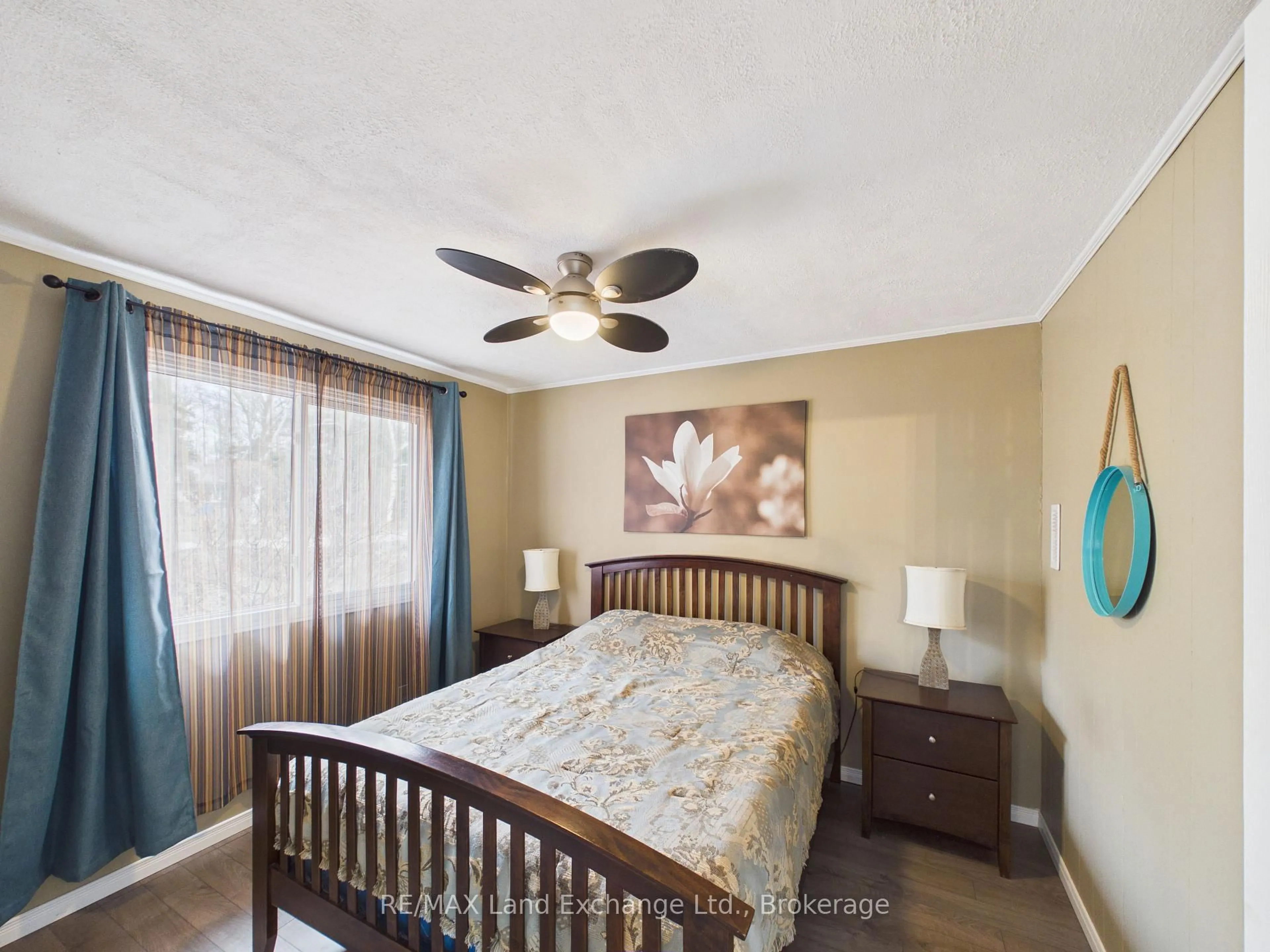 Bedroom with bed, wood/laminate floor for 507 Abenaki Dr, Huron-Kinloss Ontario N2Z 2X3