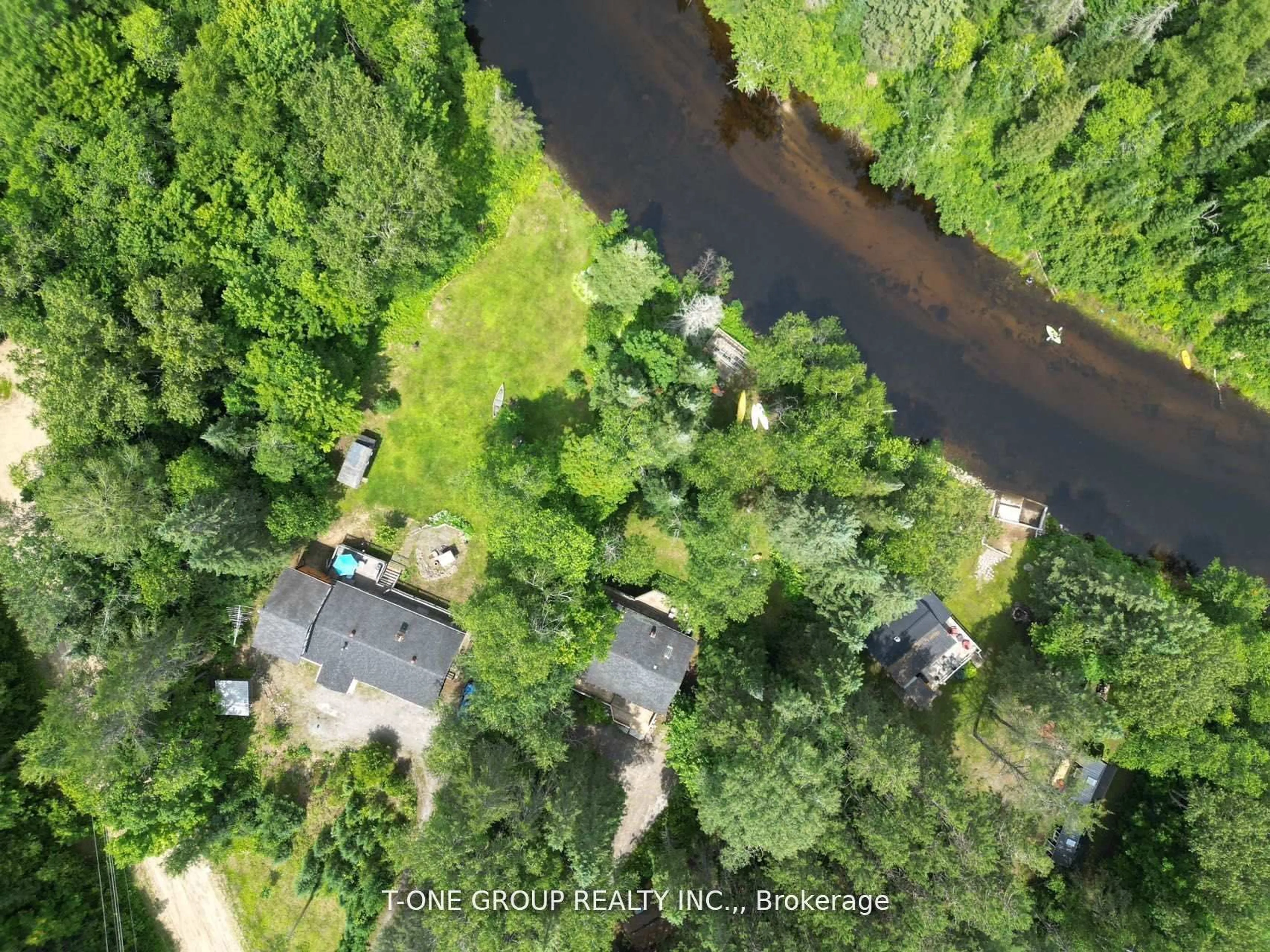 A pic from outside/outdoor area/front of a property/back of a property/a pic from drone, water/lake/river/ocean view for 10 Riverside Crct, Bancroft Ontario K0L 1C0