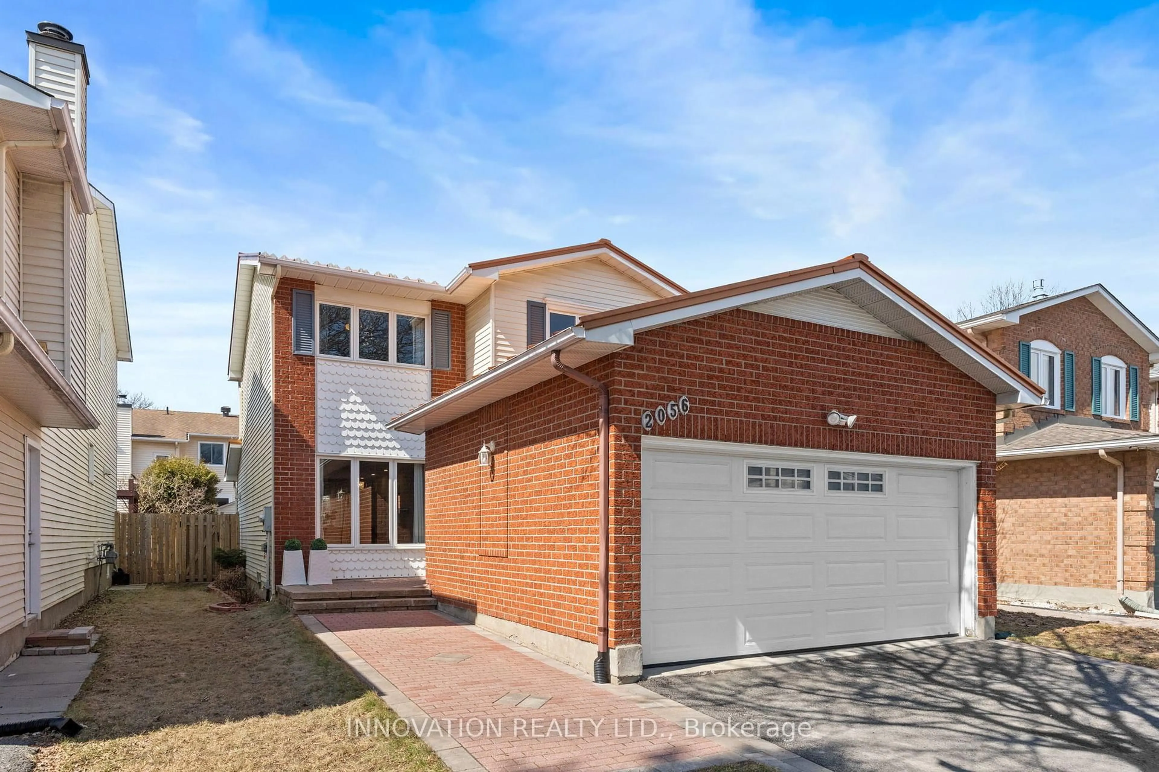 Home with brick exterior material, street for 2056 Wildflower Dr, Orleans Ontario K1E 3R3