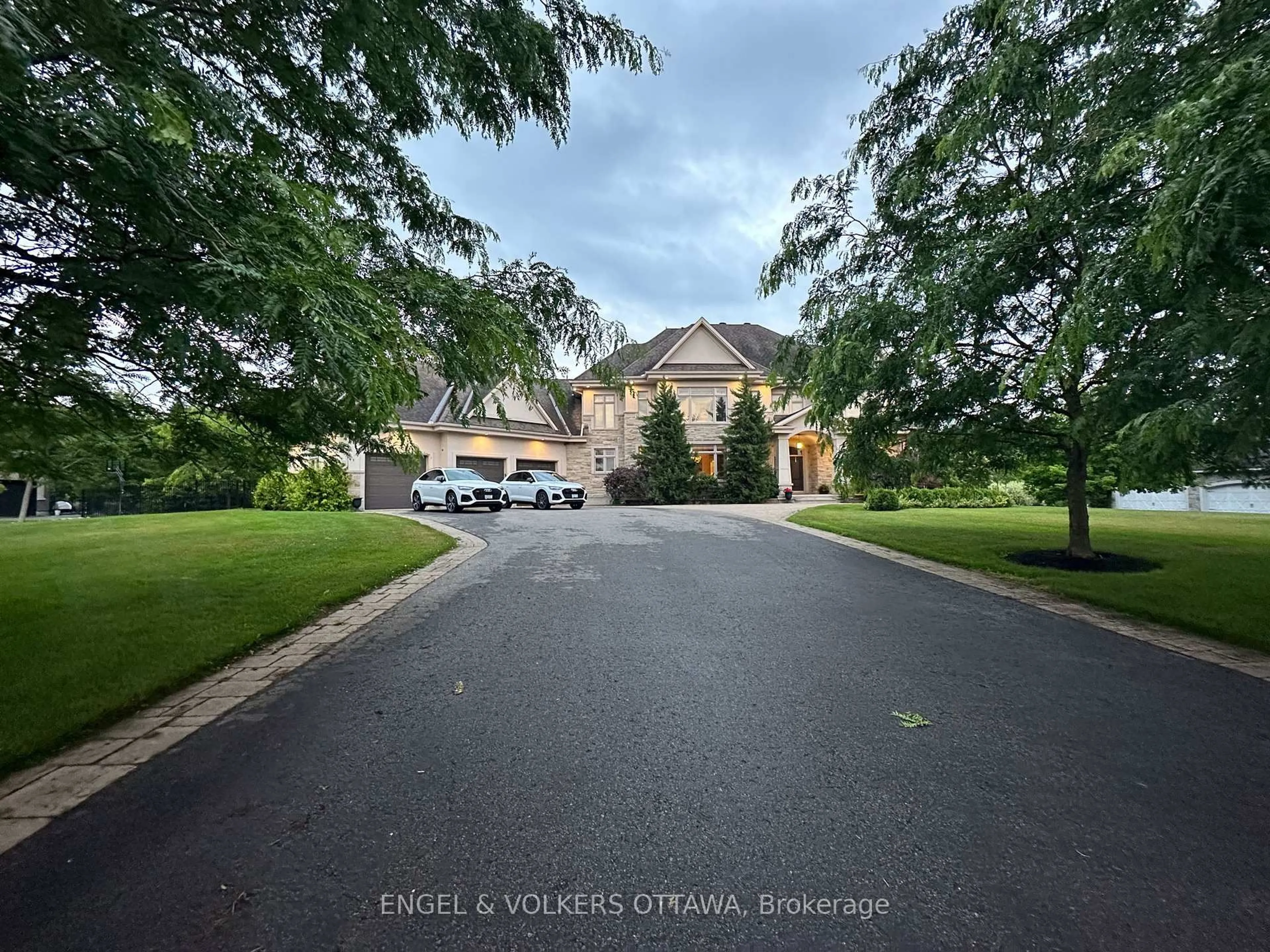 A pic from outside/outdoor area/front of a property/back of a property/a pic from drone, street for 5796 Longhearth Way, Manotick Ontario K4M 1M1