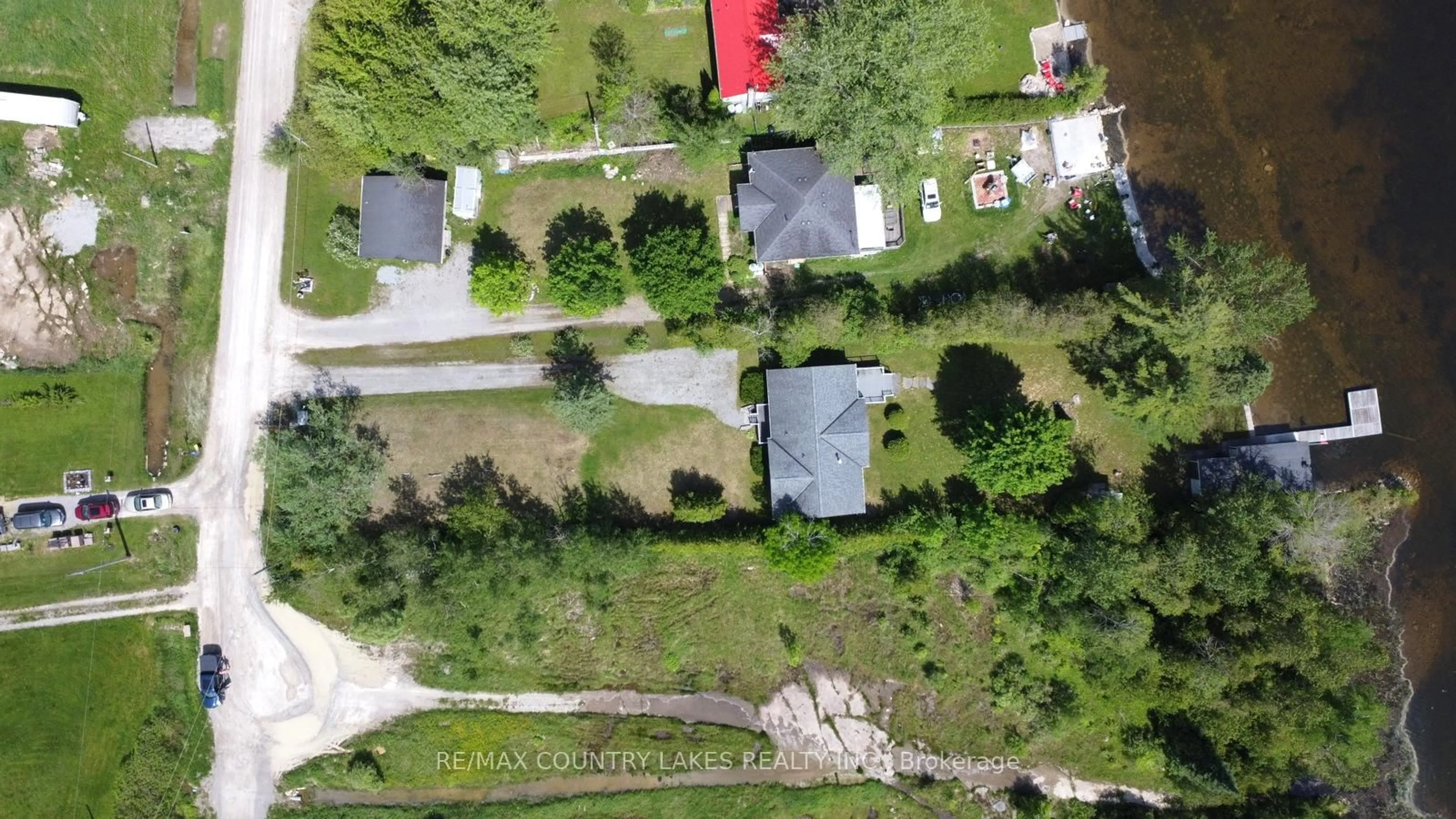 A pic from outside/outdoor area/front of a property/back of a property/a pic from drone, street for 275 McGuire Beach Rd, Kawartha Lakes Ontario K0M 2B0