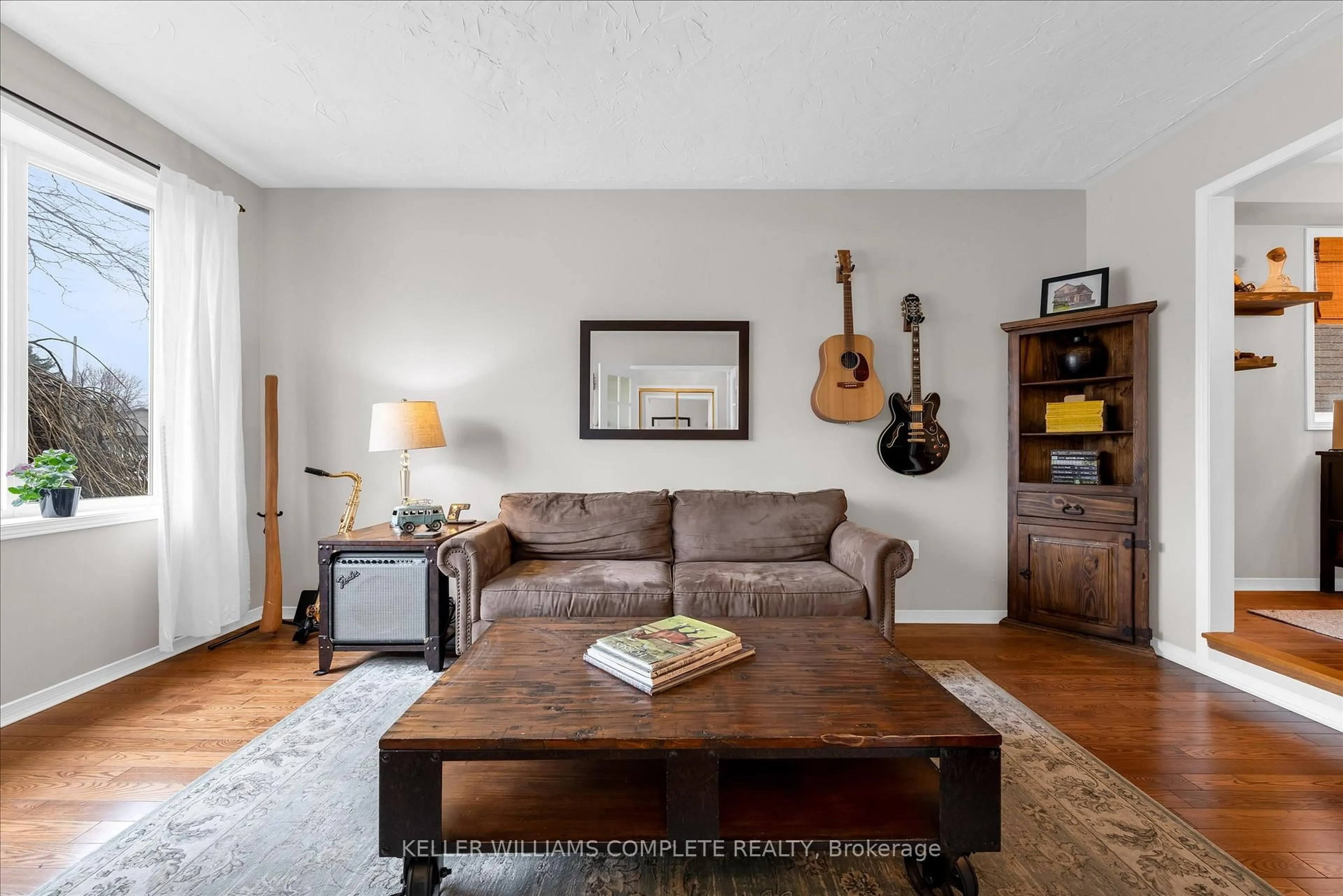 Living room with furniture, wood/laminate floor for 16 Homeland Ave, Hamilton Ontario L8E 4X2