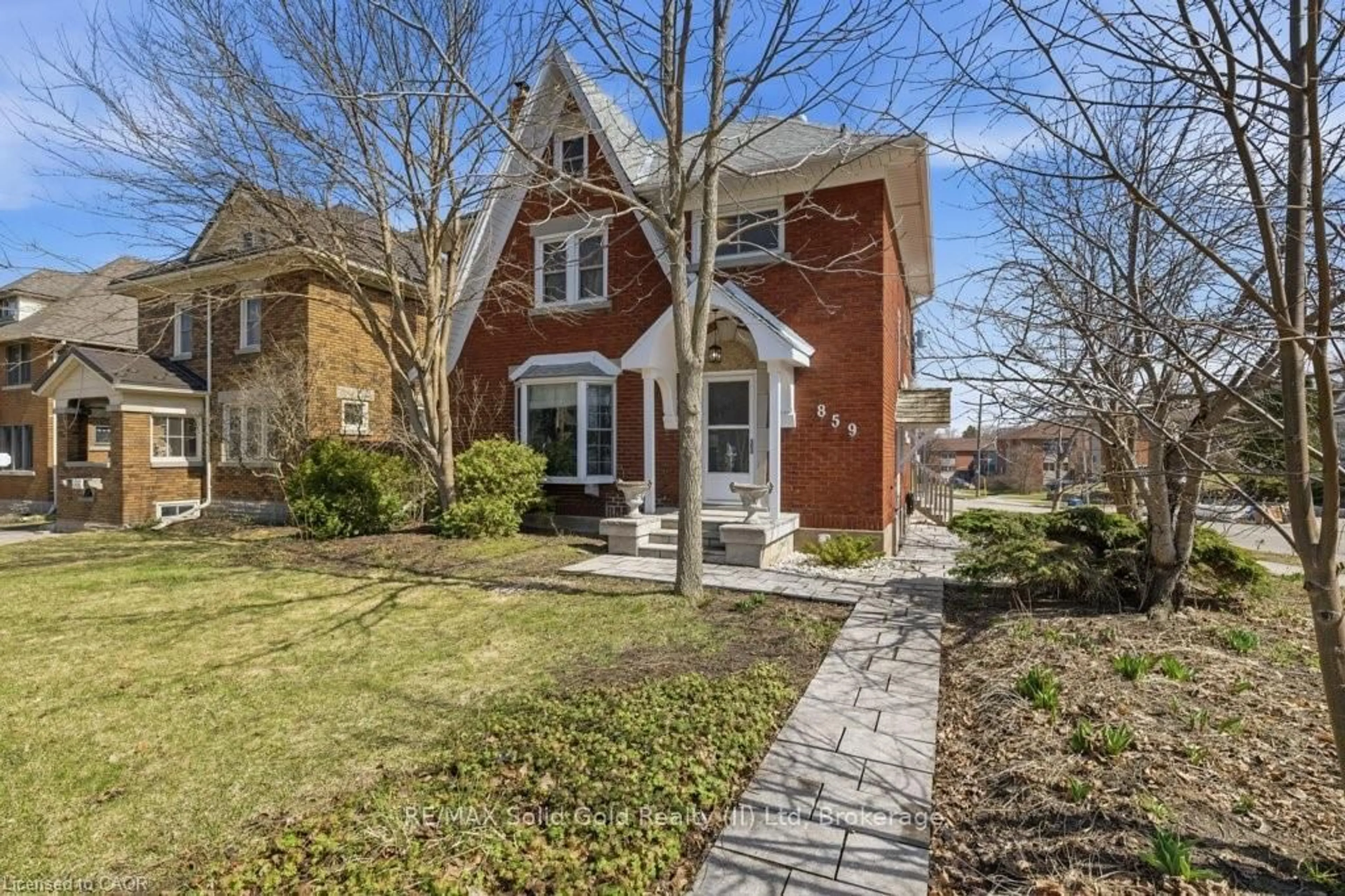 Home with brick exterior material, street for 859 Queen's Blvd, Kitchener Ontario N2M 1A6