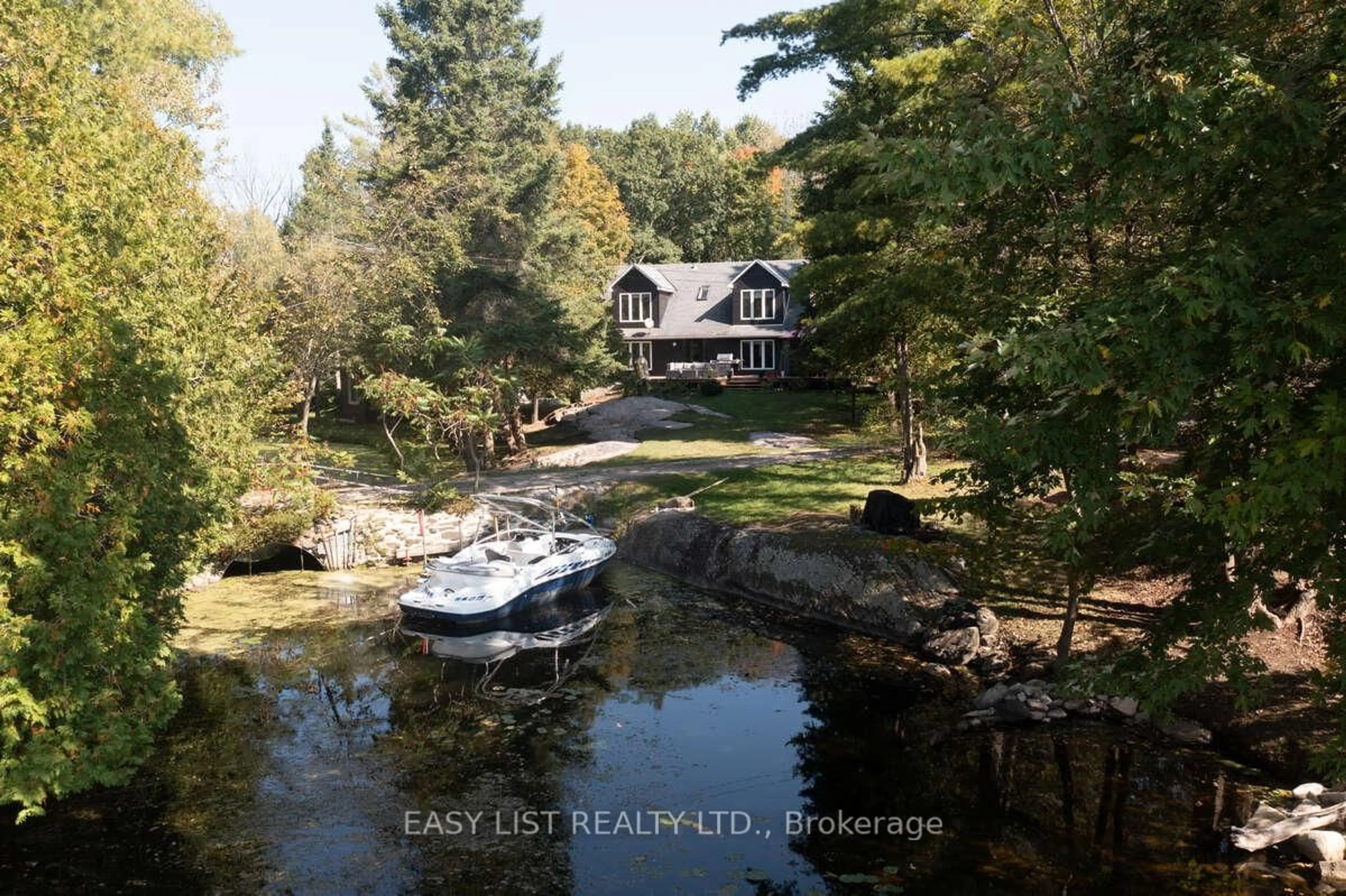 A pic from outside/outdoor area/front of a property/back of a property/a pic from drone, water/lake/river/ocean view for 64 Fire Route 96, Trent Lakes Ontario K0M 1A0