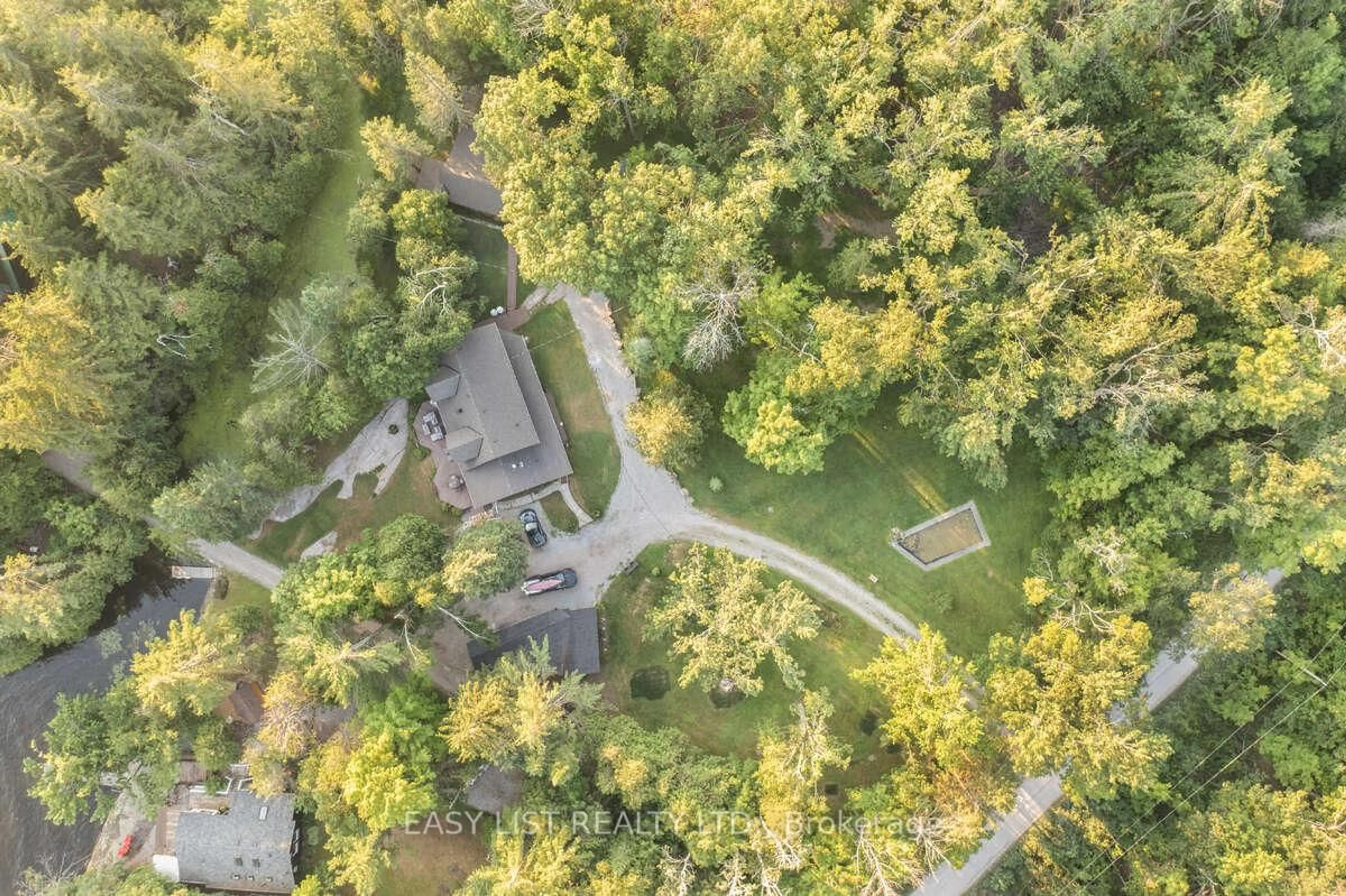A pic from outside/outdoor area/front of a property/back of a property/a pic from drone, forest/trees view for 64 Fire Route 96, Trent Lakes Ontario K0M 1A0