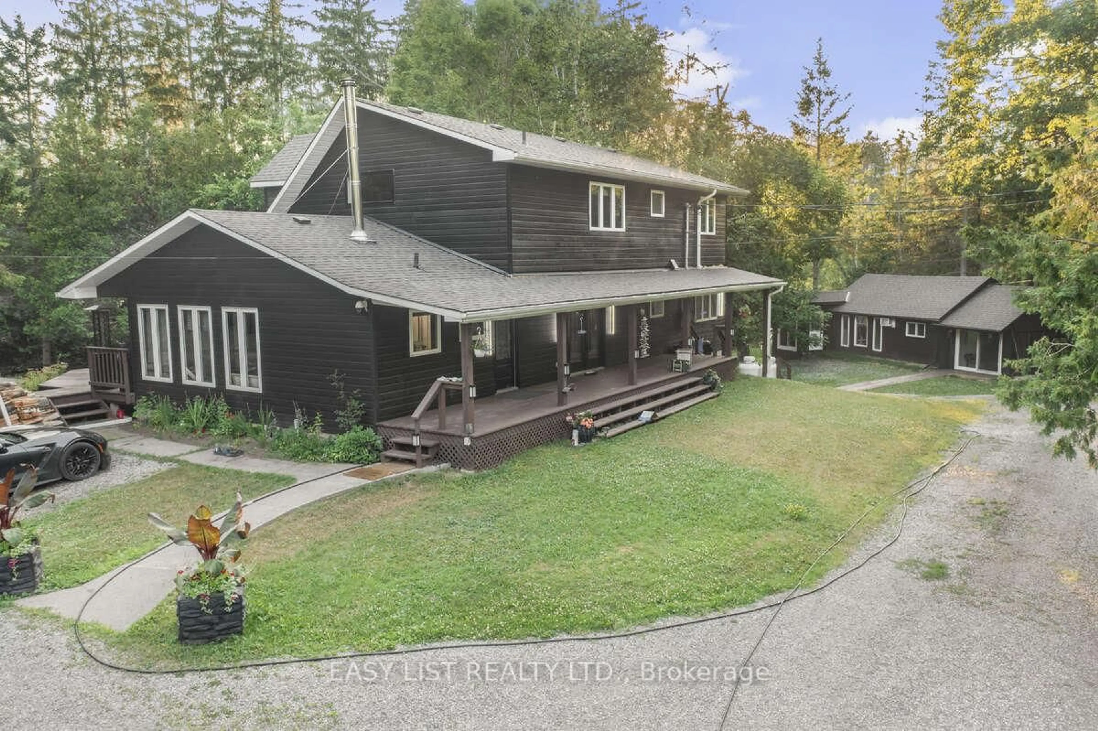 A pic from outside/outdoor area/front of a property/back of a property/a pic from drone, mountain view for 64 Fire Route 96, Trent Lakes Ontario K0M 1A0