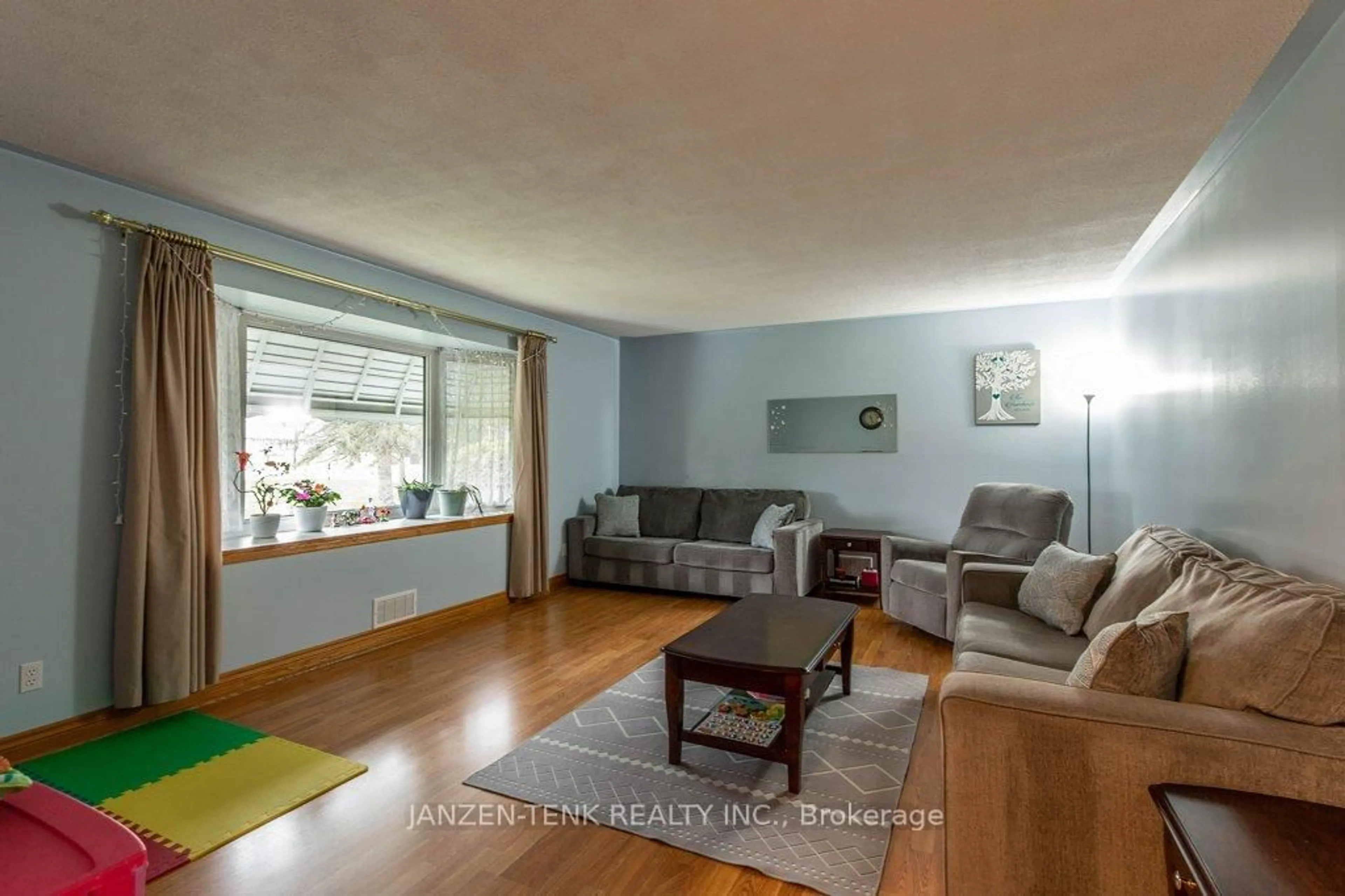 Living room with furniture, wood/laminate floor for 273 Main St, Norfolk Ontario N0J 1E0