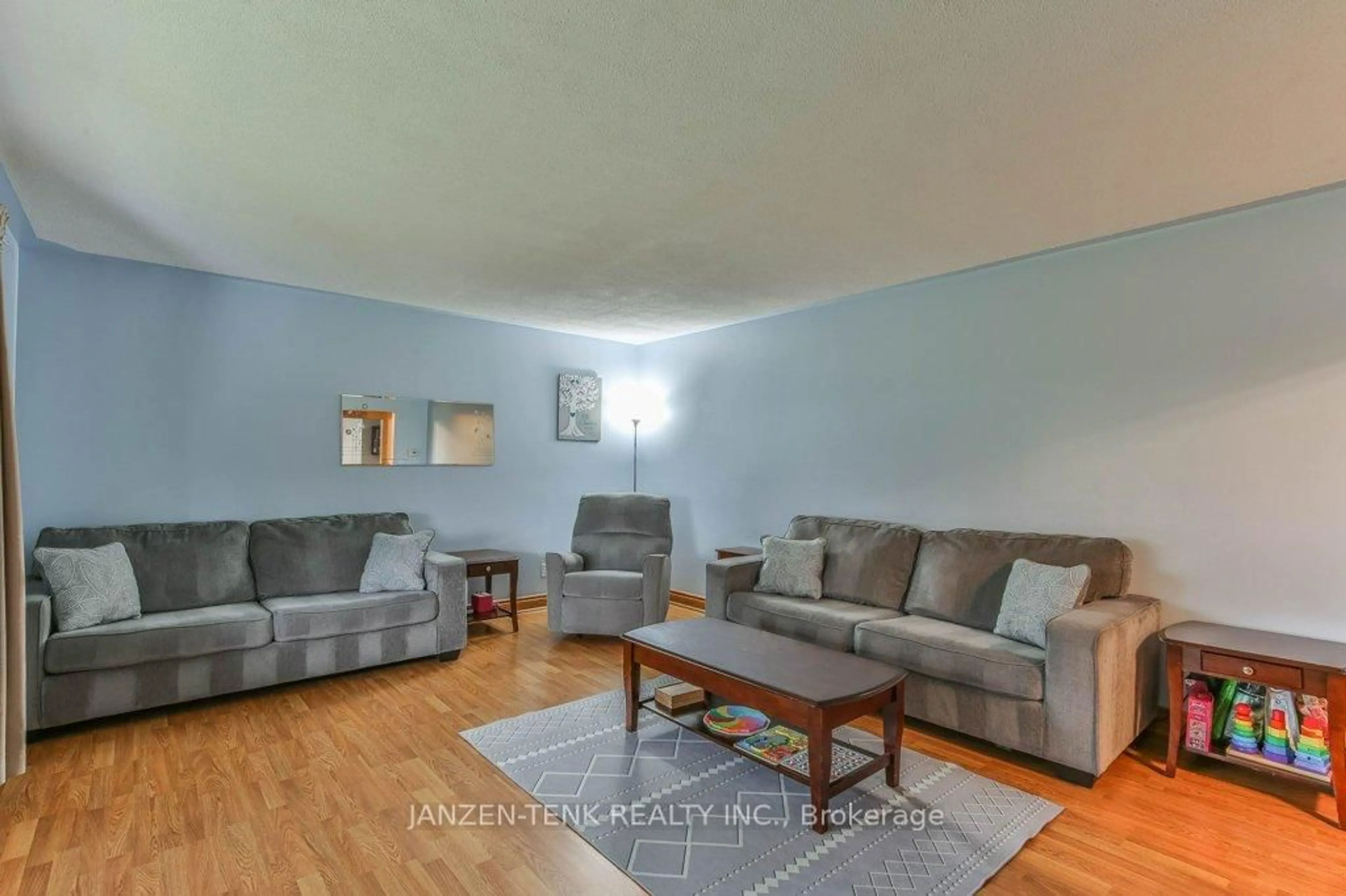 Living room with furniture, wood/laminate floor for 273 Main St, Norfolk Ontario N0J 1E0