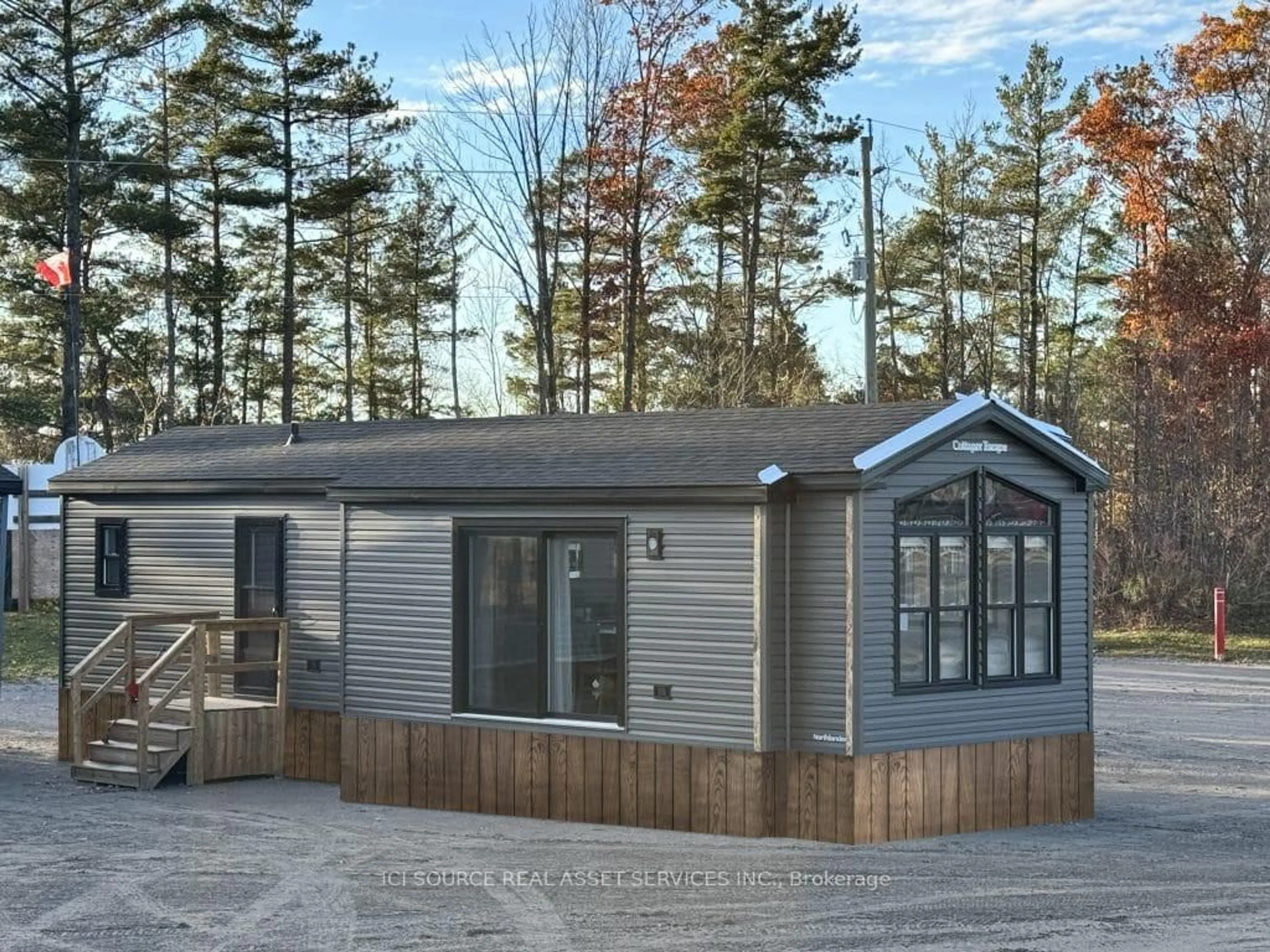 Home with vinyl exterior material, street for 1047 Bonnie Lake Camp Rd #TRILM, Bracebridge Ontario P1L 1W9