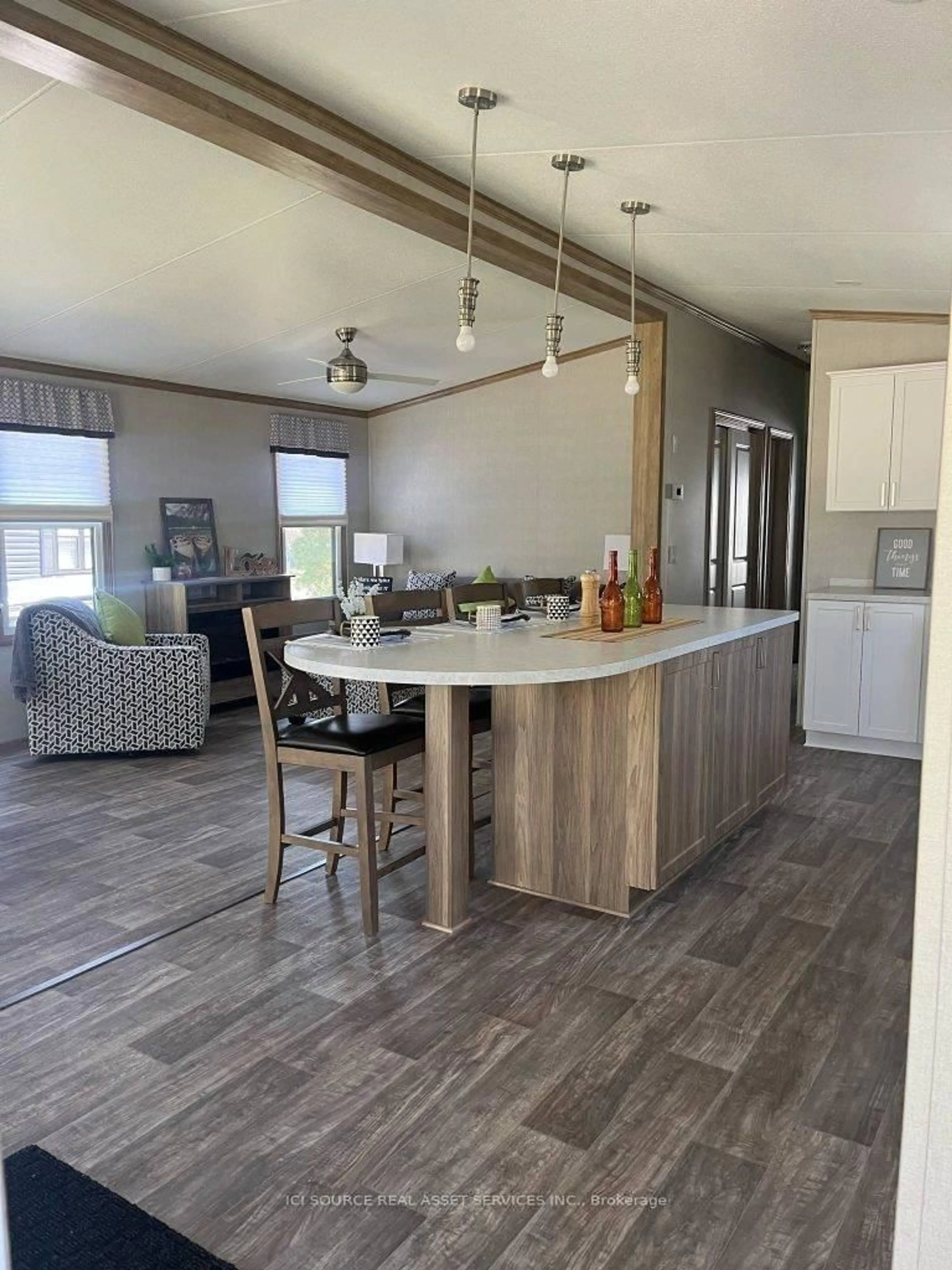 Open concept kitchen, wood/laminate floor for 1047 Bonnie Lake Camp Rd #LKR023, Bracebridge Ontario P1L 1W9
