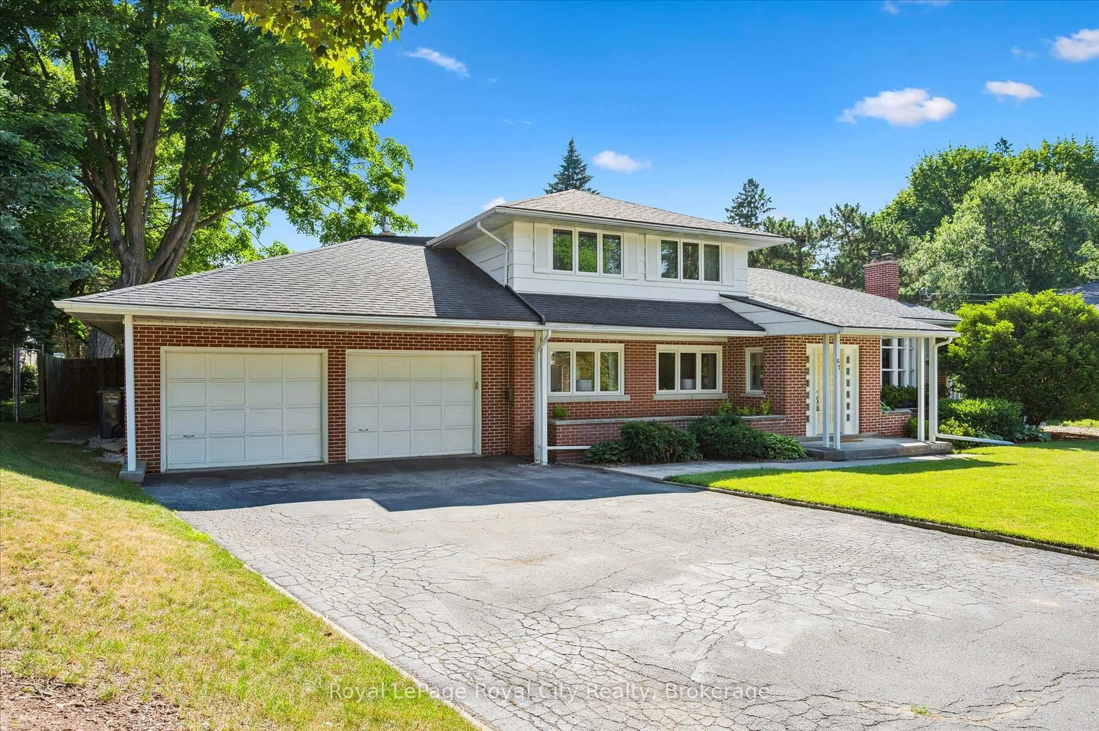 Home with brick exterior material, street for 67 Woodside Rd, Guelph Ontario N1G 2H1