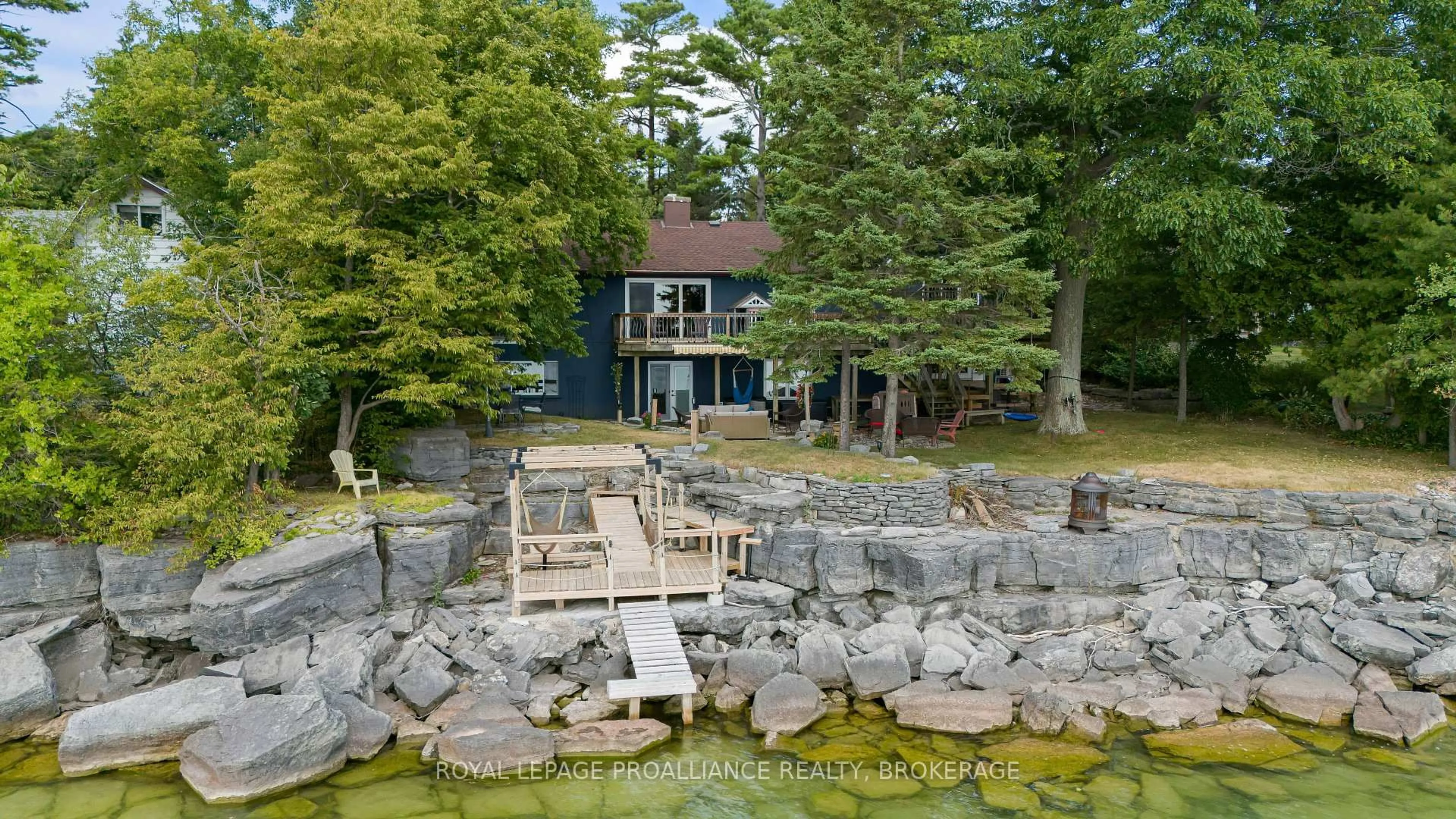 A pic from outside/outdoor area/front of a property/back of a property/a pic from drone, water/lake/river/ocean view for 182 Nicholson Point Rd, Bath Ontario K0H 1G0