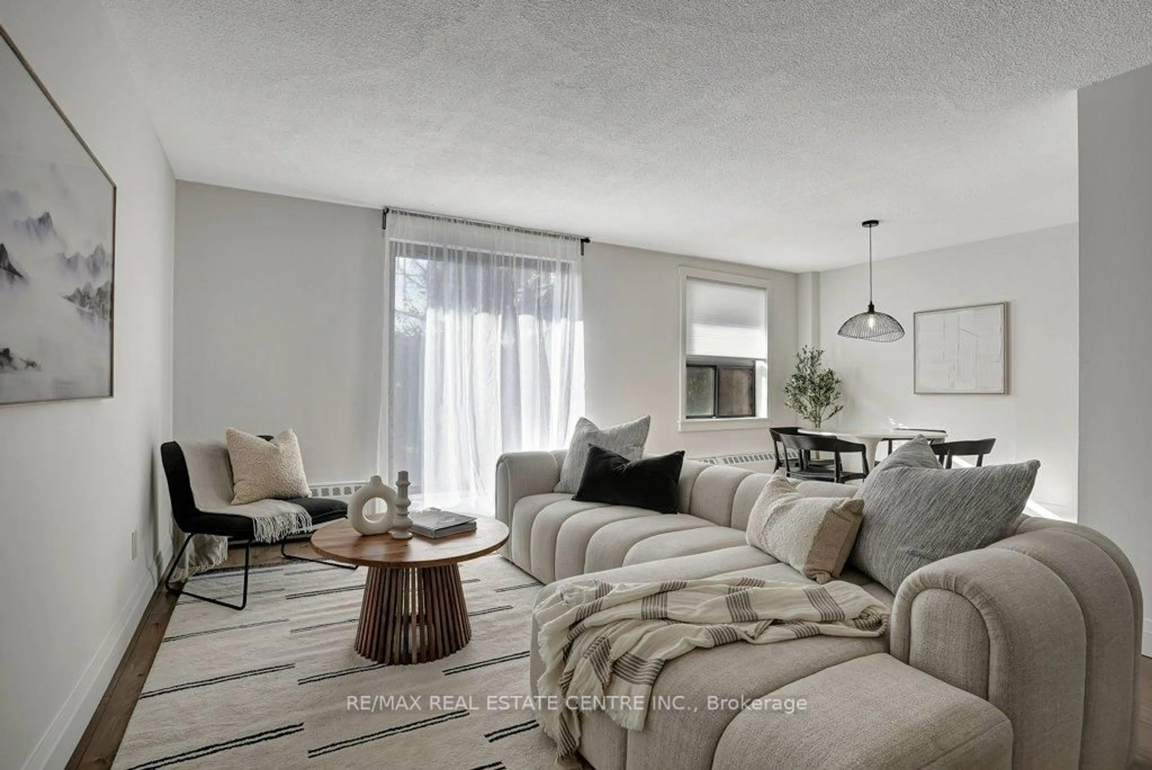 Living room with furniture, unknown for 1100 Courtland Ave #107, Kitchener Ontario N2C 2H9