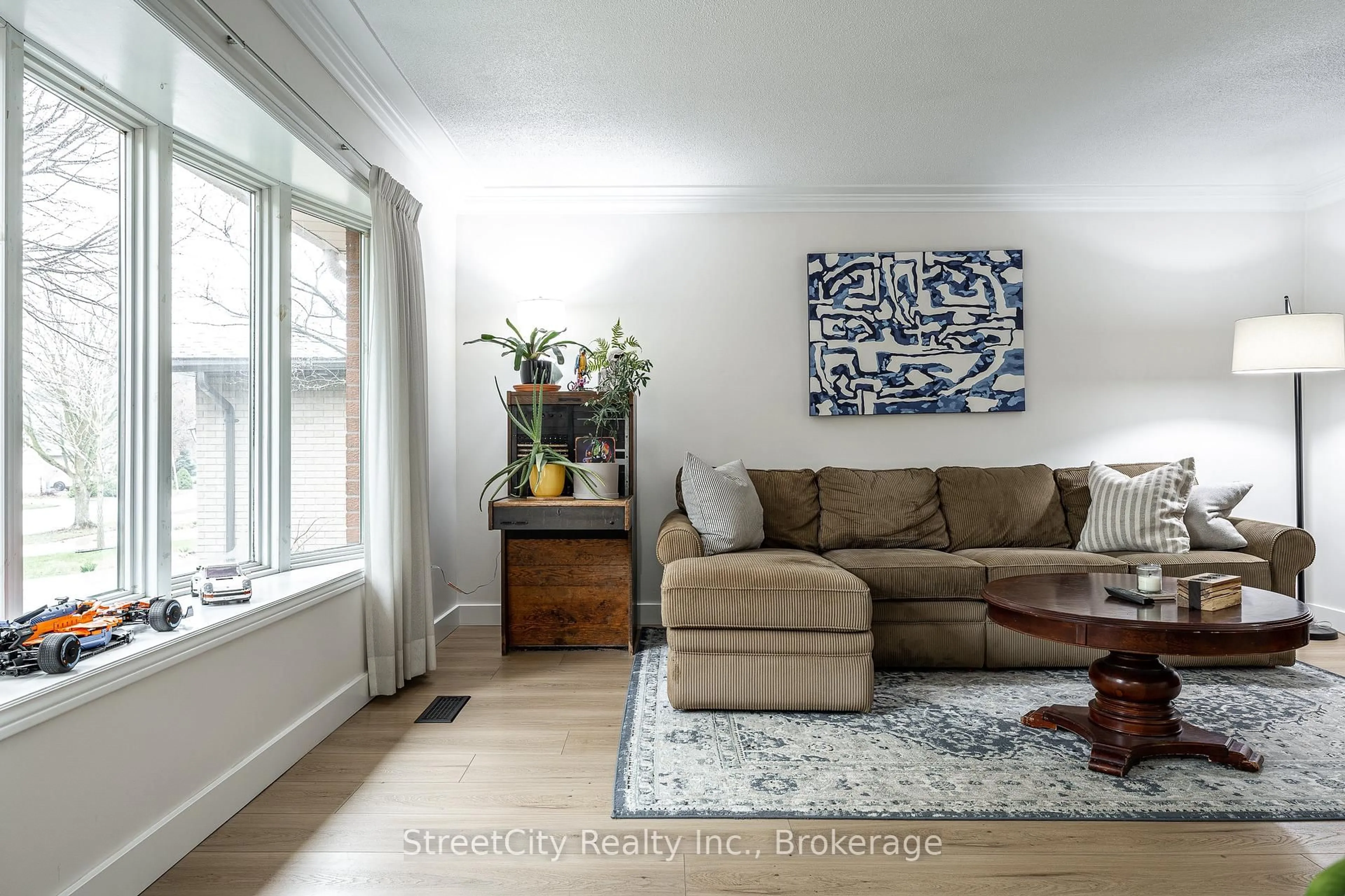 Living room with furniture, wood/laminate floor for 34 White St, Stratford Ontario N5A 7M5