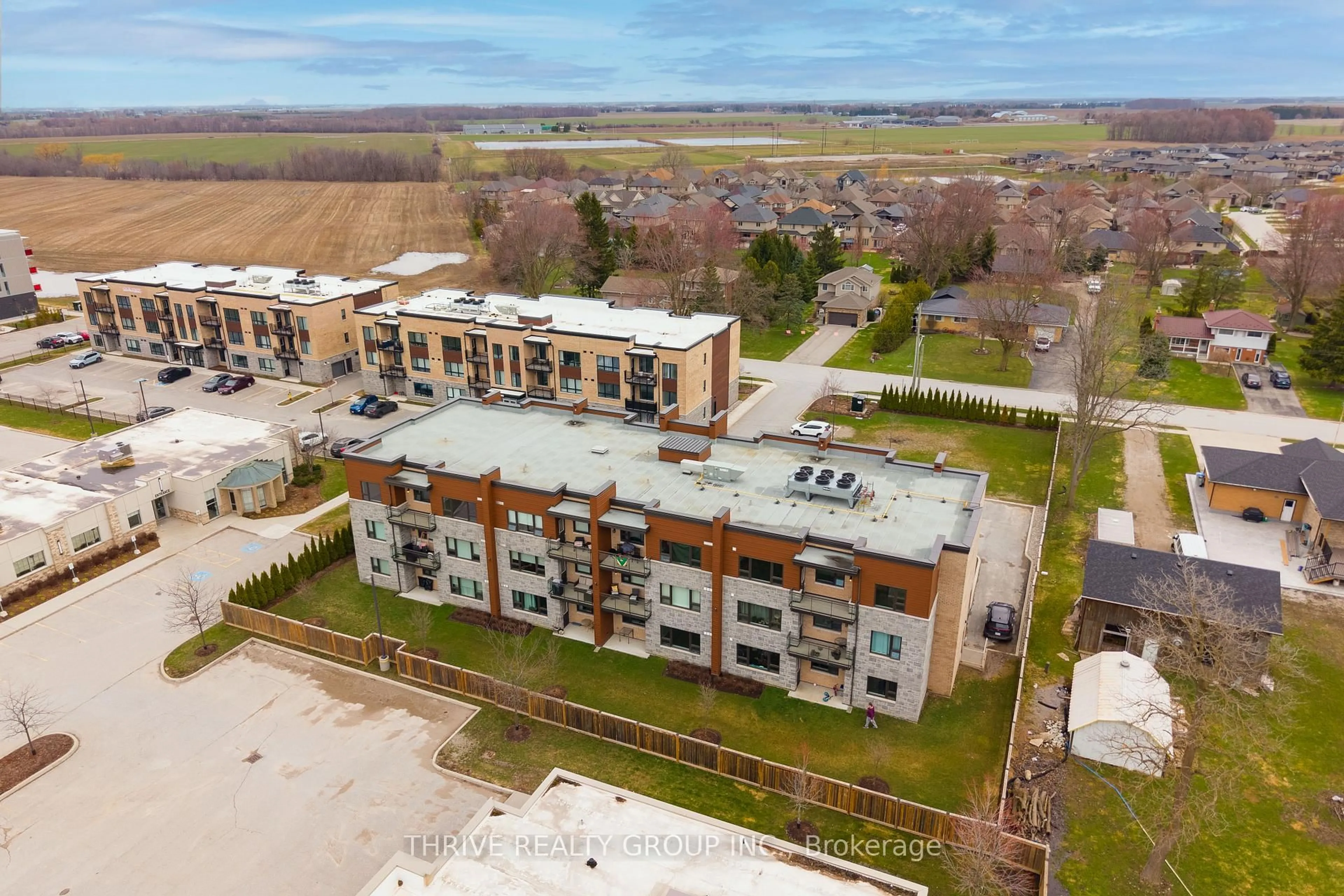A pic from outside/outdoor area/front of a property/back of a property/a pic from drone, building for 263 Butler St #306, Lucan Biddulph Ontario N0M 2J0