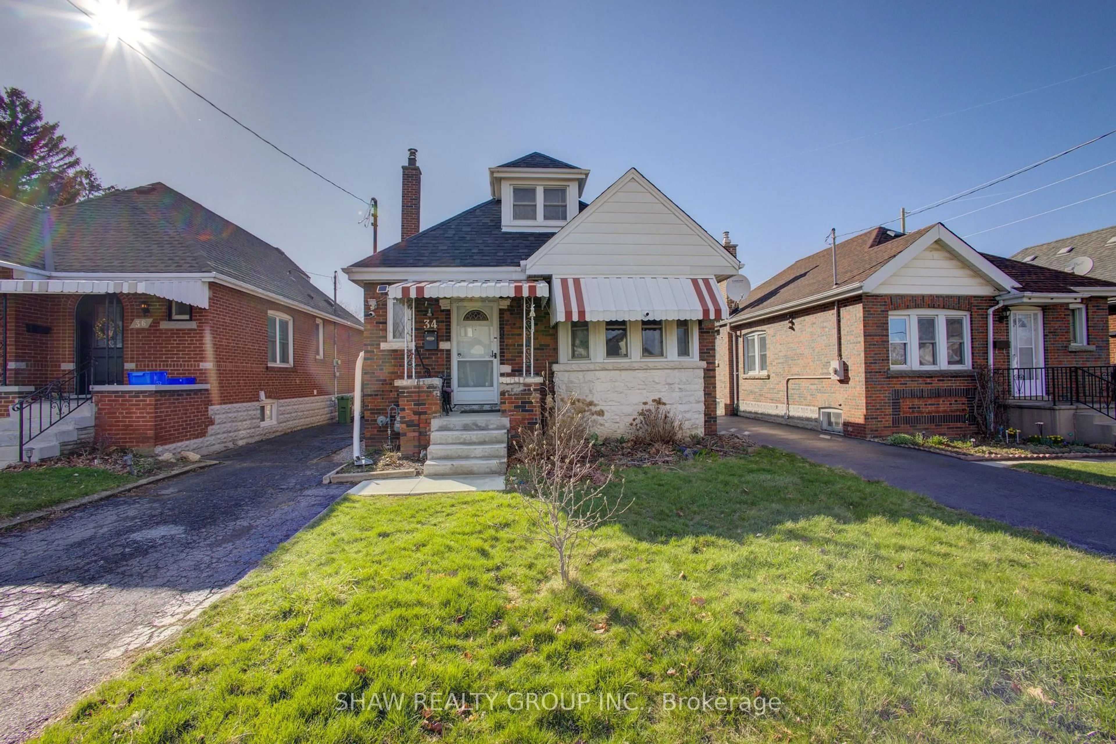 Home with brick exterior material, street for 34 Barons Ave, Hamilton Ontario L8K 2Y2