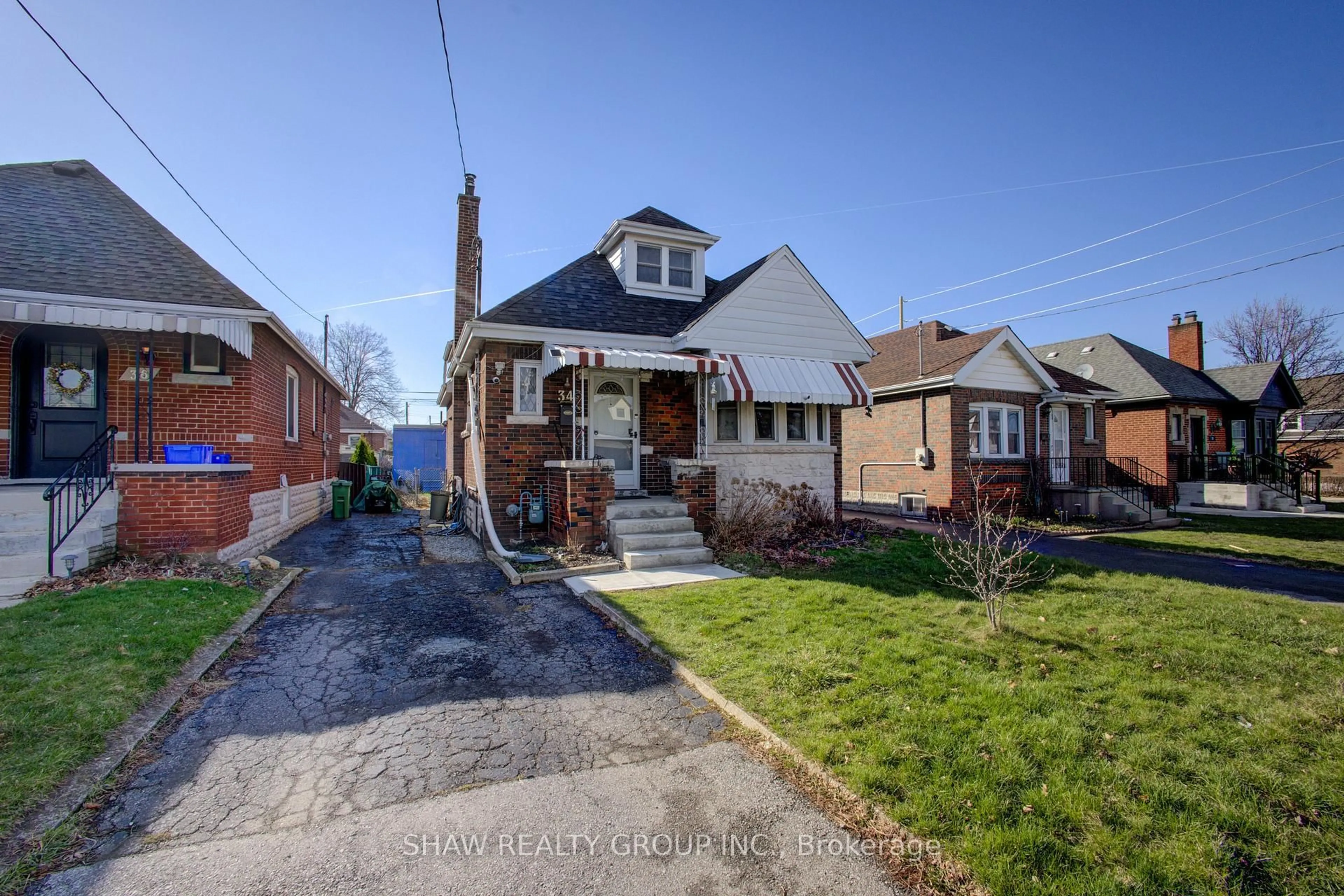 Home with brick exterior material, street for 34 Barons Ave, Hamilton Ontario L8K 2Y2